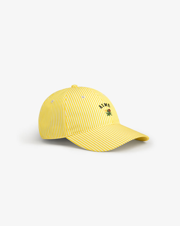 Striped Crest Logo Hat: Yellow and white stripes with a small green palm tree and black front text embroidery.