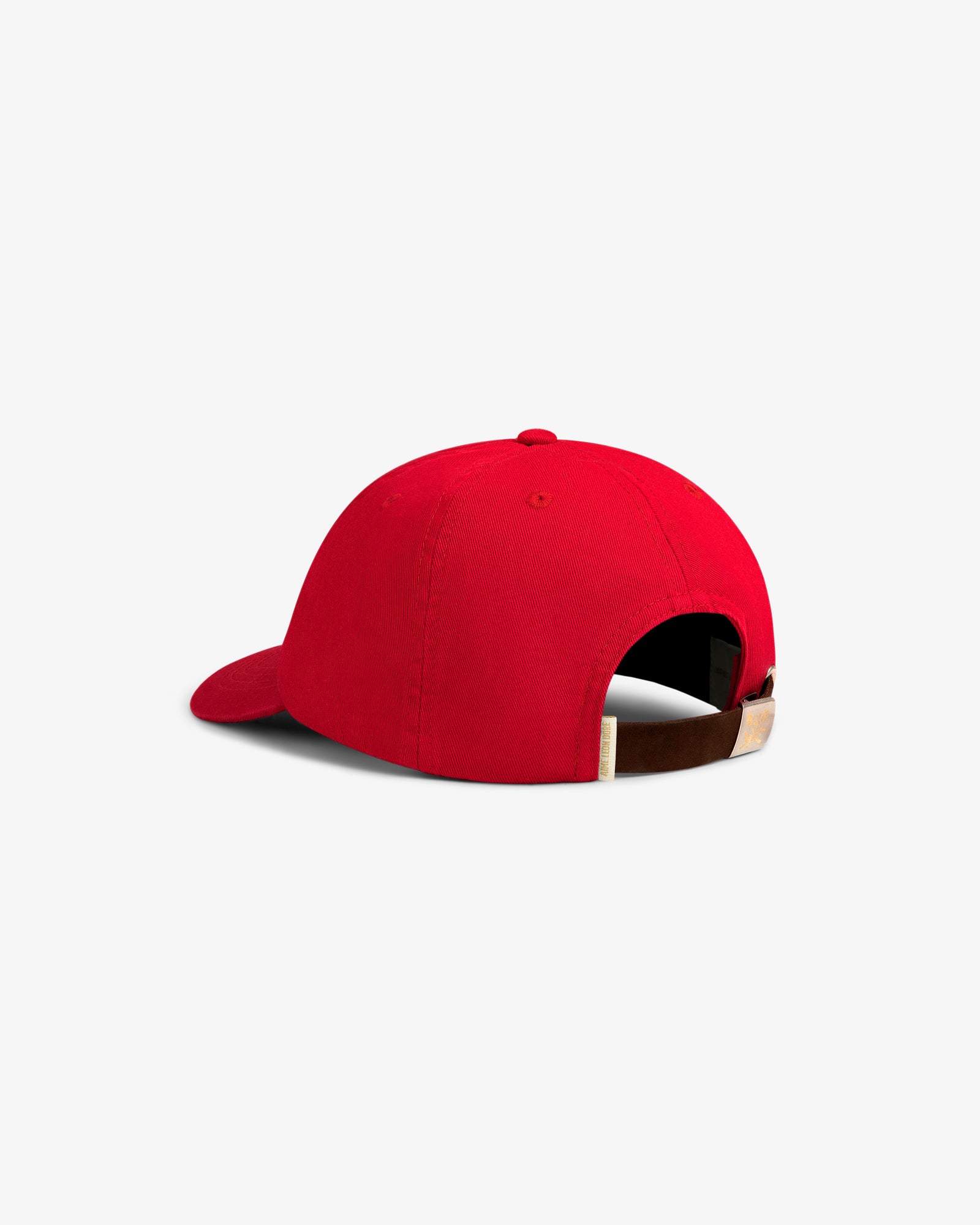 The Crest Logo Hat is a red baseball cap with an adjustable brown strap and buckle, shown from the back on white.