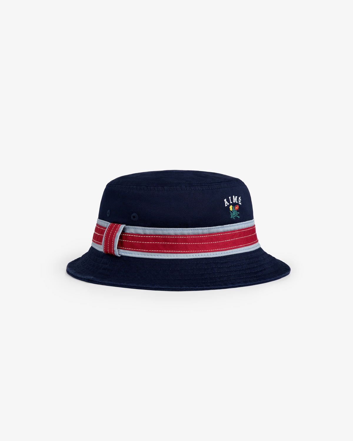 Crest Bucket Hat in navy blue with a red and white striped band, embroidered text, and flower on the front.
