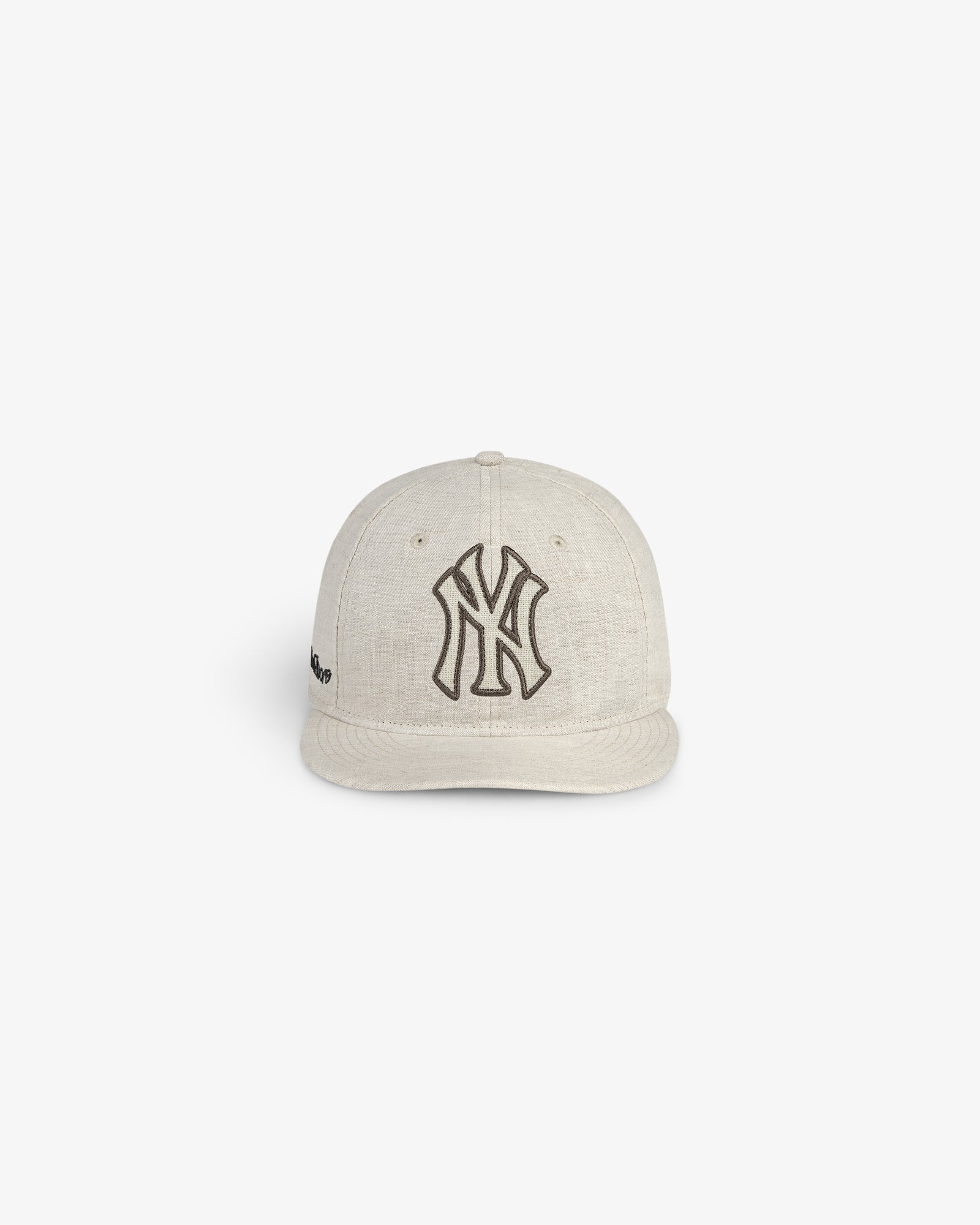 ALD / New York Yankees Retro Fit Hat in beige with a black logo, shown on a plain white background.