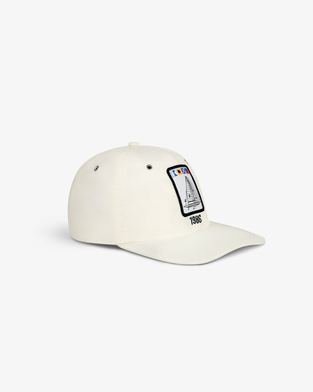Nylon Deck Hat in off-white with a front panel patch showing a sailboat and 1986 embroidery.