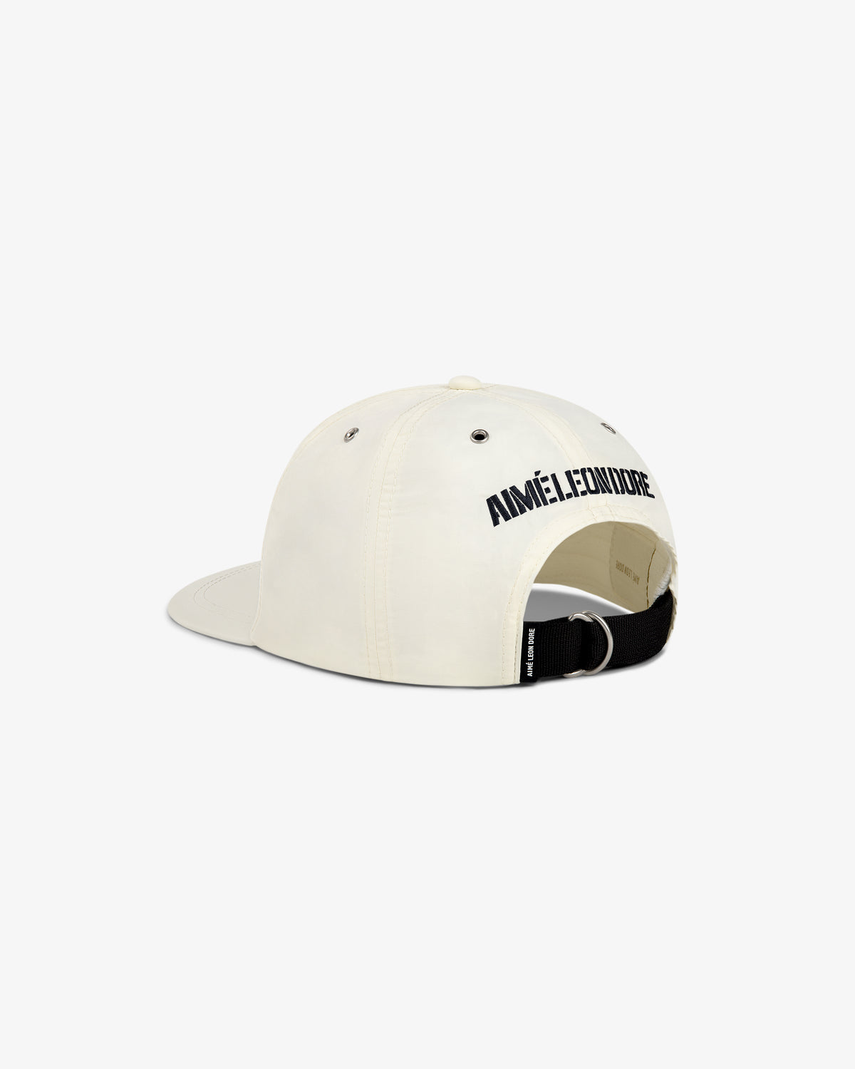 Back view of a cream Nylon Deck Hat with AIMÉ LEON DORE in black above the adjustable strap.