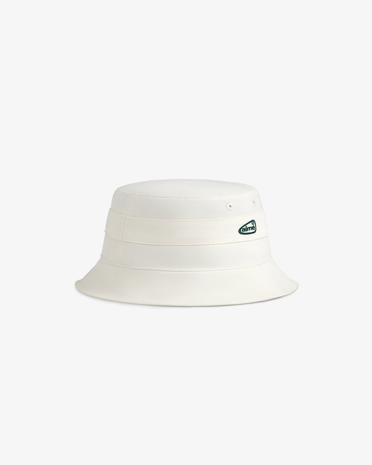 ALD Golf Bucket Hat in off-white with a small oval green and white logo patch on the side, shown on a white background.
