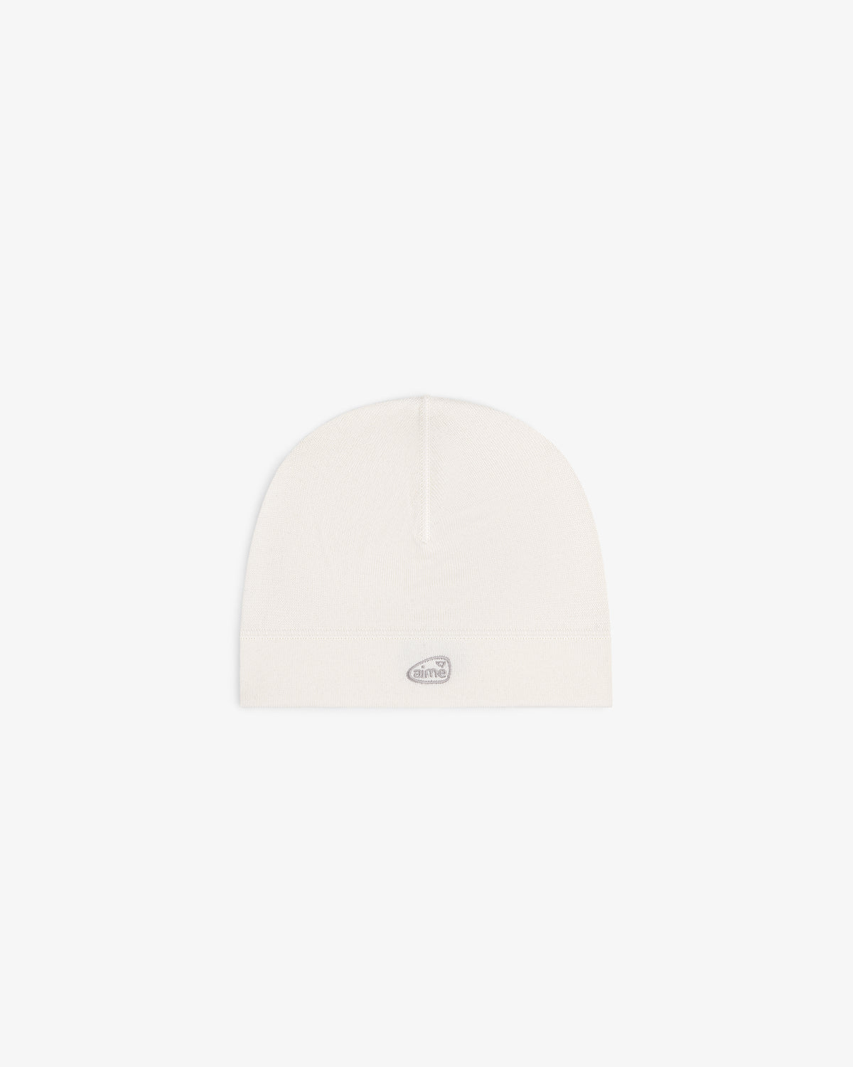ALD Golf Skull Cap in off-white with a small oval silver logo patch on the front, shown on a white background.