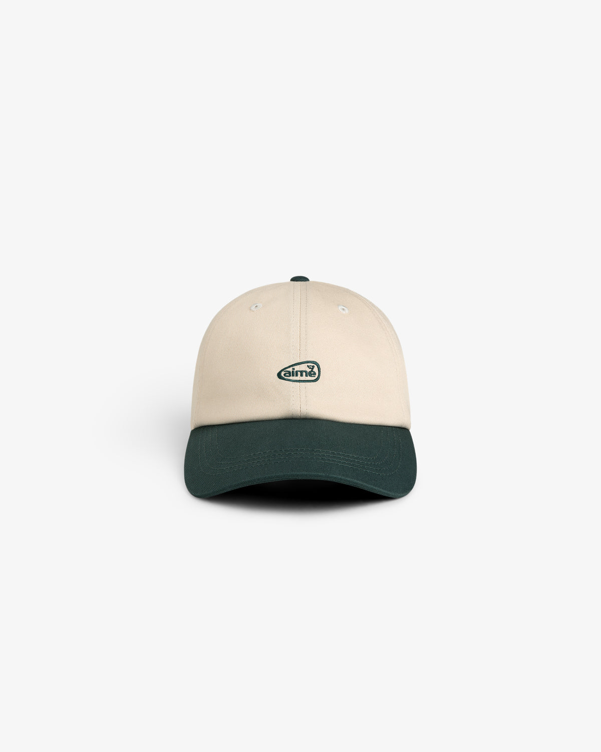 ALD Golf Logo Hat in beige with a dark green brim and small oval logo, shown on a plain white background.