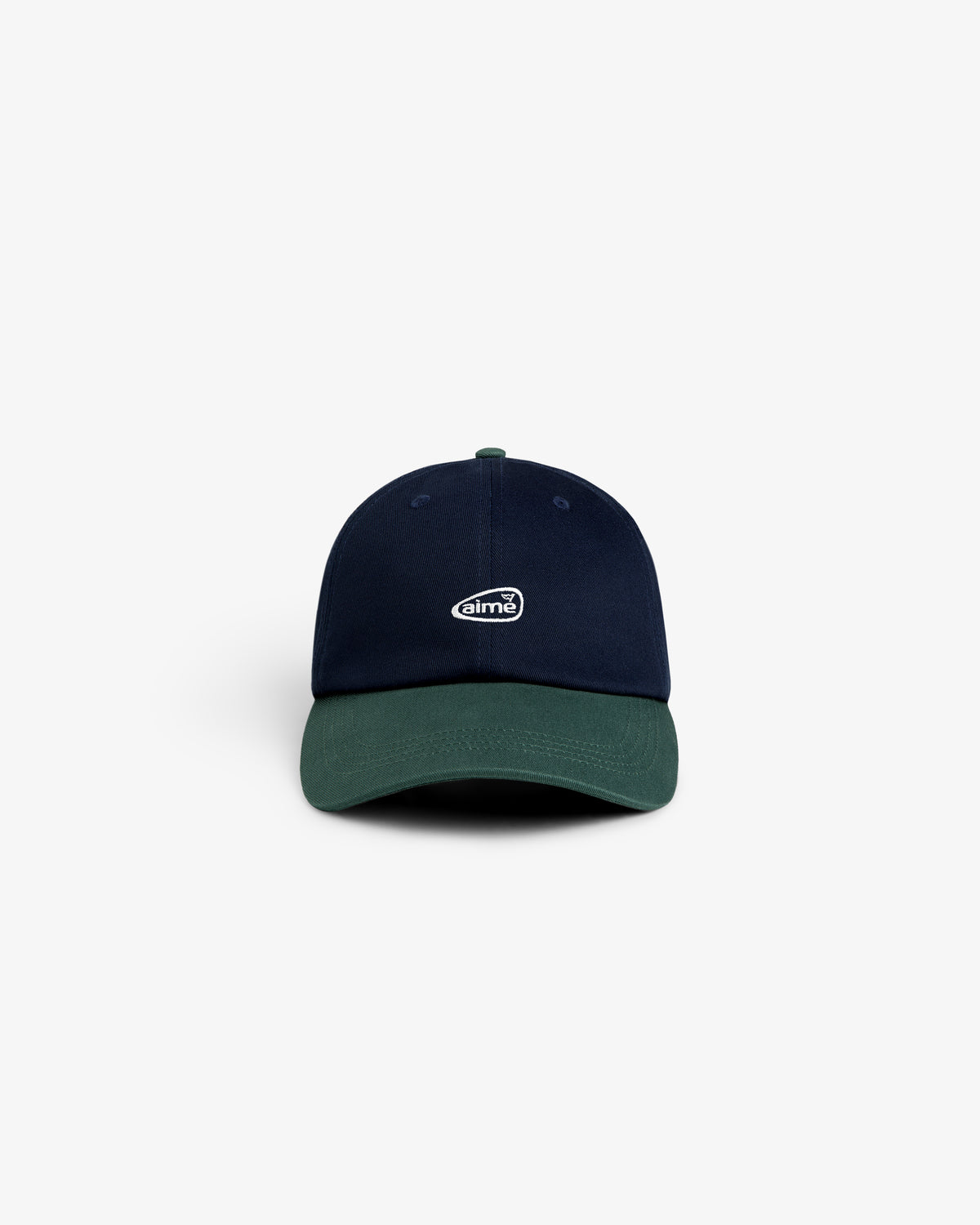 The ALD Golf Logo Hat is navy blue with a dark green brim and a small white aimé logo on the front.