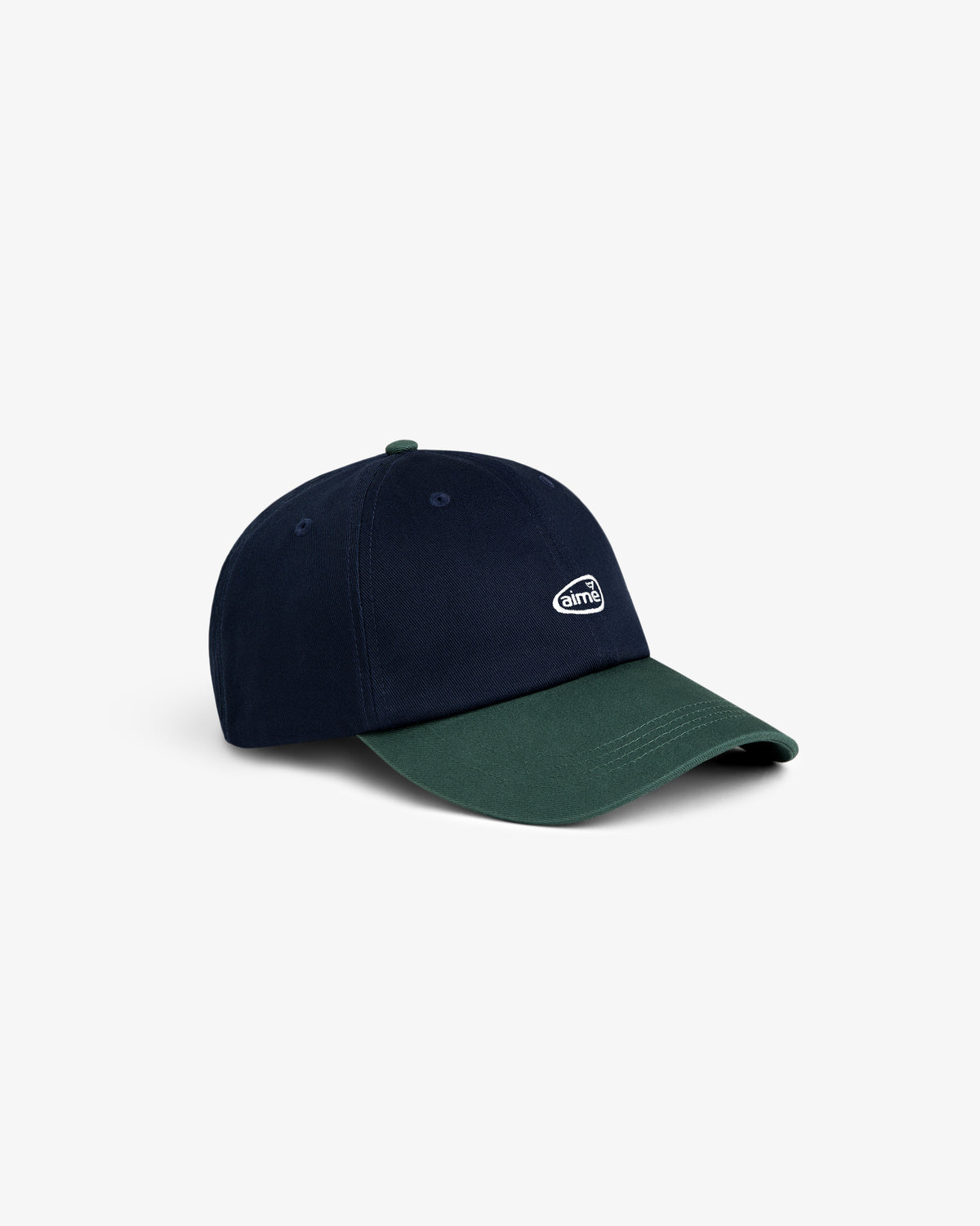 The ALD Golf Logo Hat is a two-tone cap with a navy crown, dark green brim, and small white logo on the front.