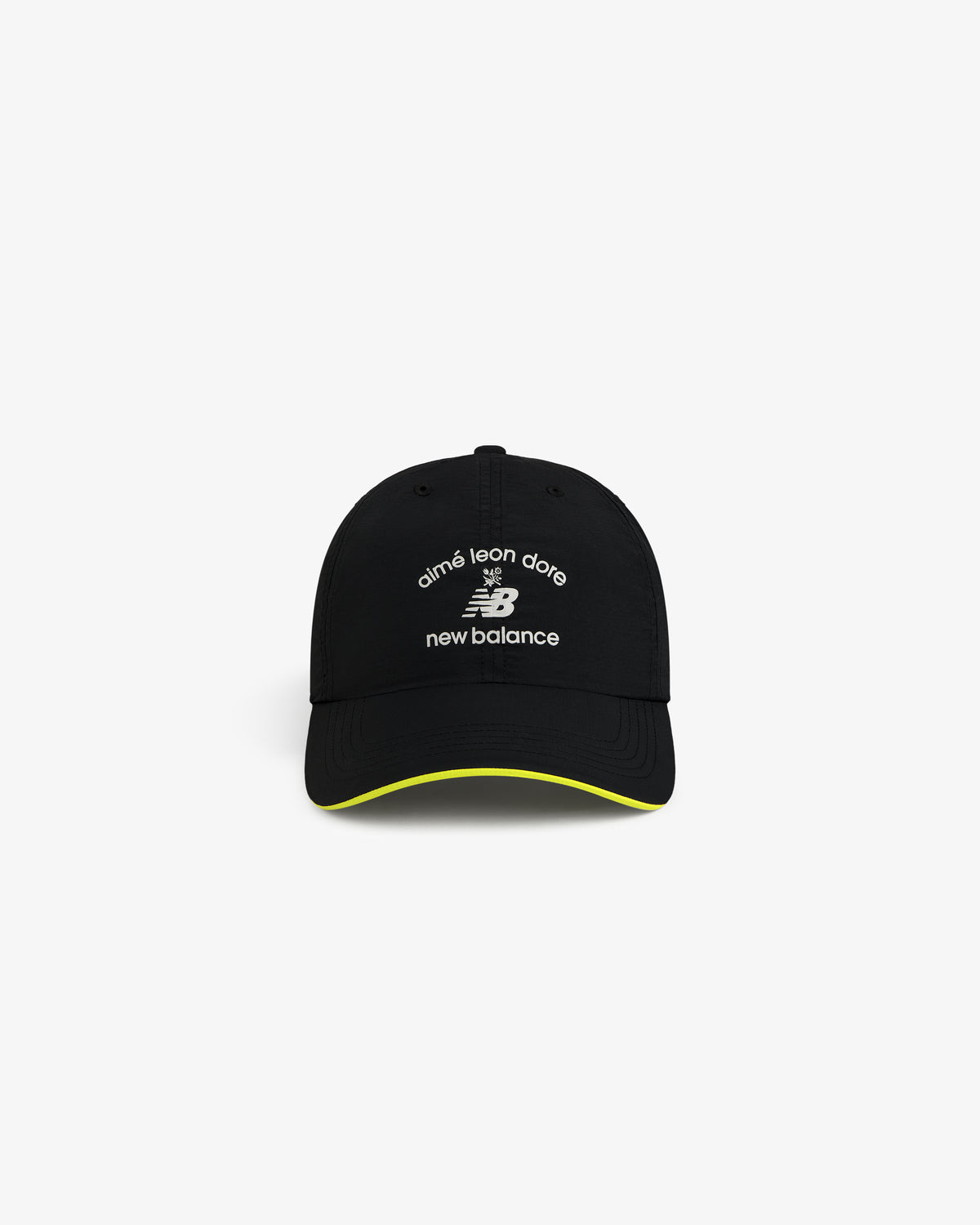 ALD / New Balance Running Hat: black cap with white logos, yellow trim on brim, shown on white background.