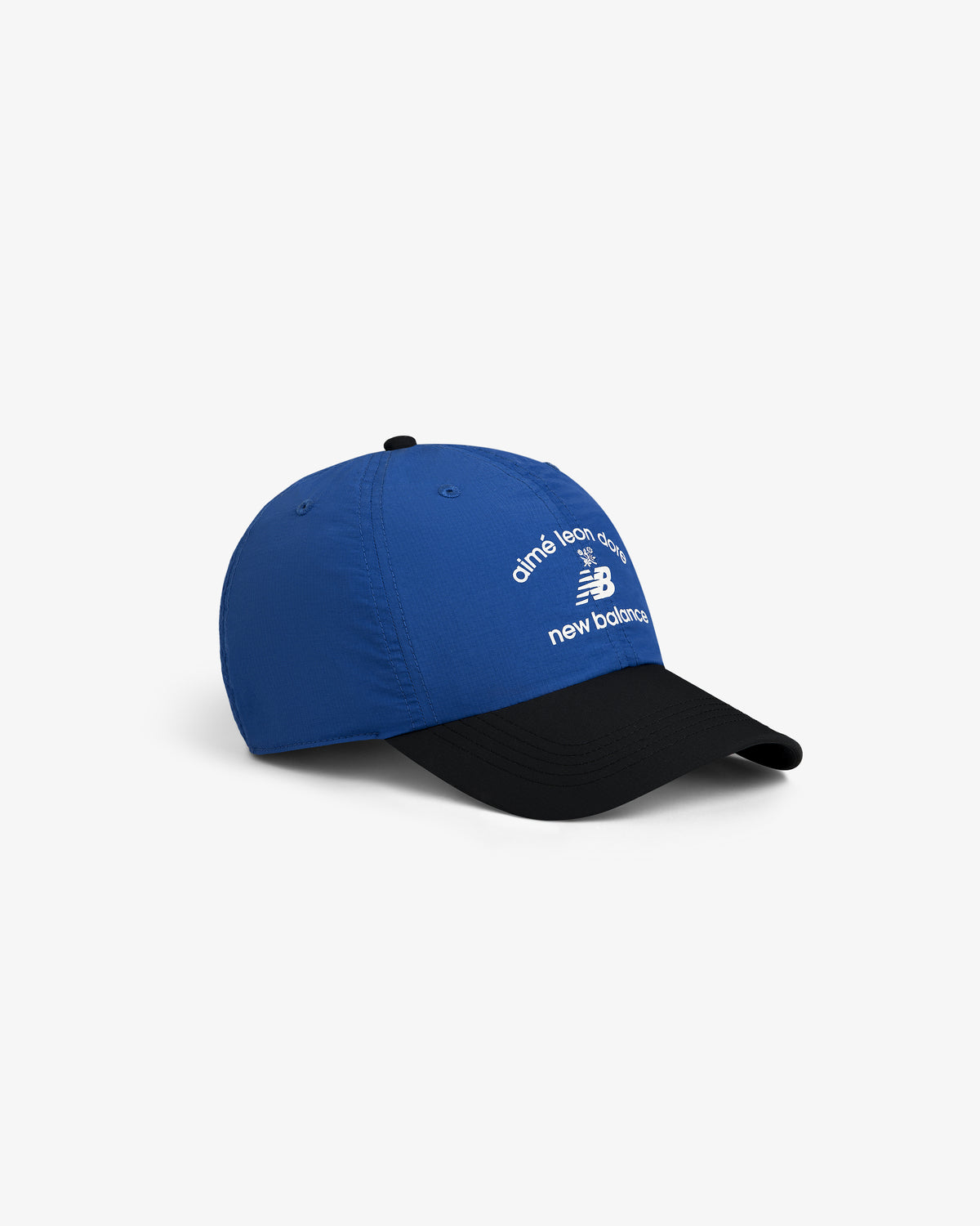 ALD / New Balance Running Hat: Blue cap with black brim, white New Balance and Aimé Leon Dore text on front.