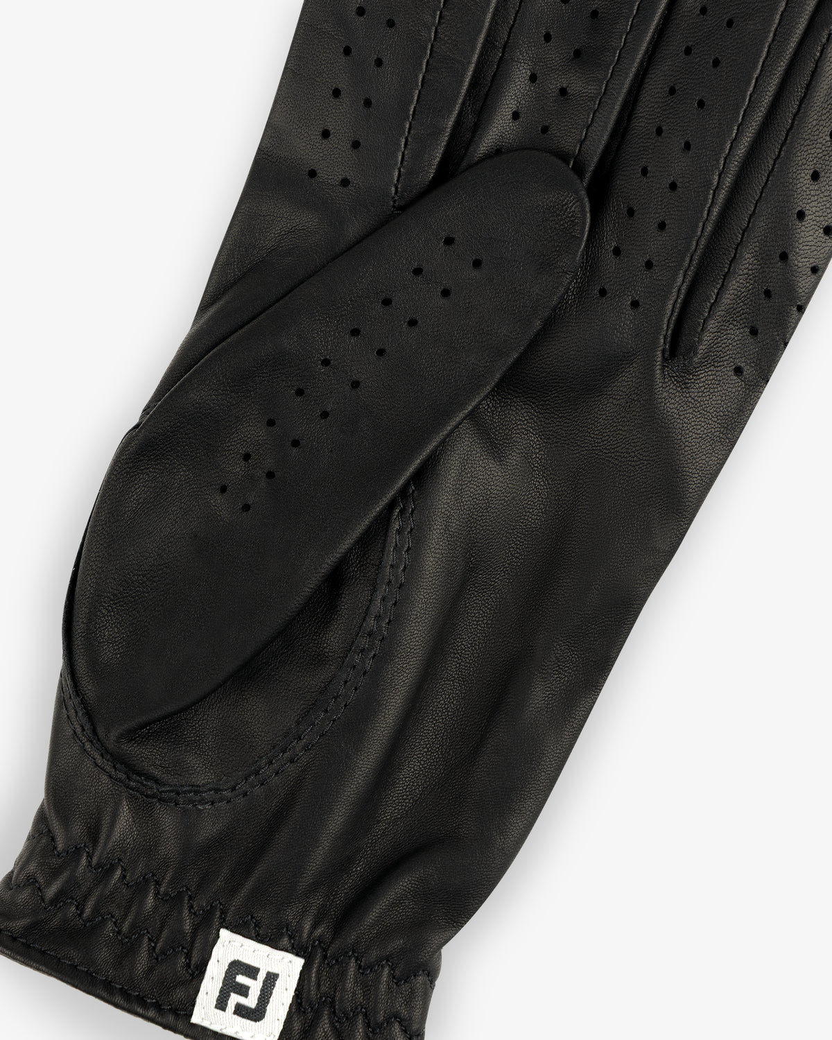 ALD / FootJoy StaSof Heritage Glove (Left) in black leather with perforations and FJ tag near the elastic wrist.