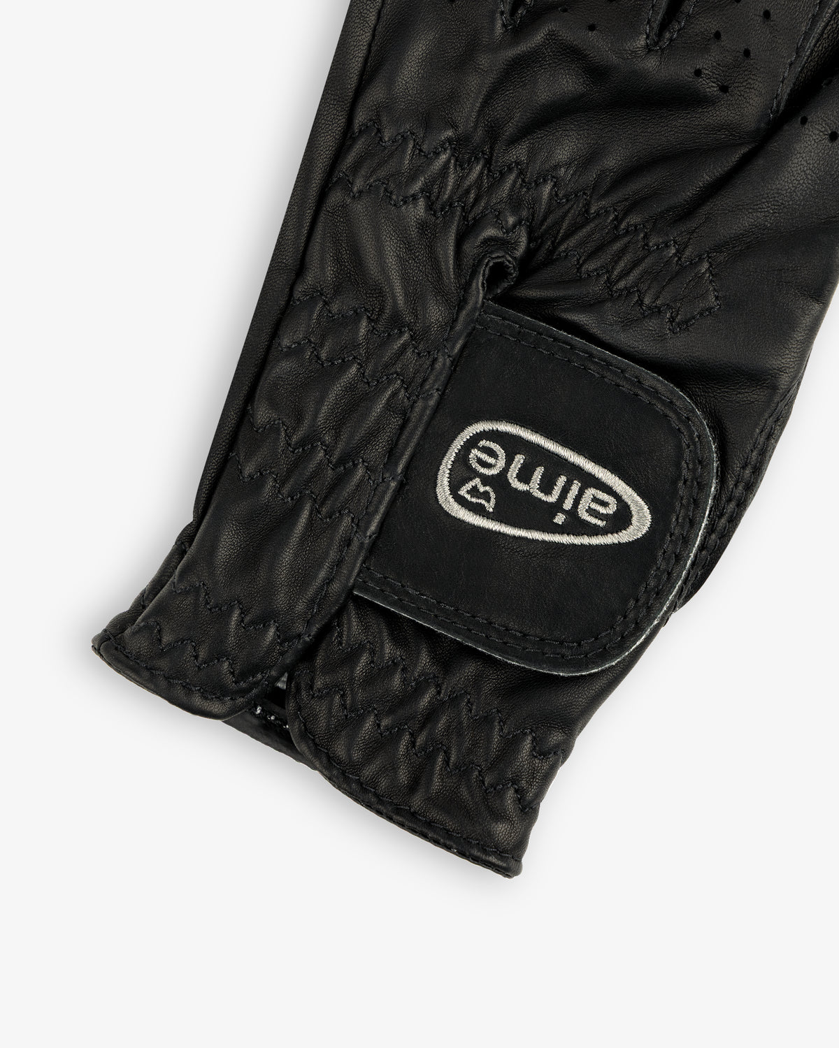 Close-up of the ALD / FootJoy StaSof Heritage Glove (Left) in black leather with visible stitching and aimé velcro strap.