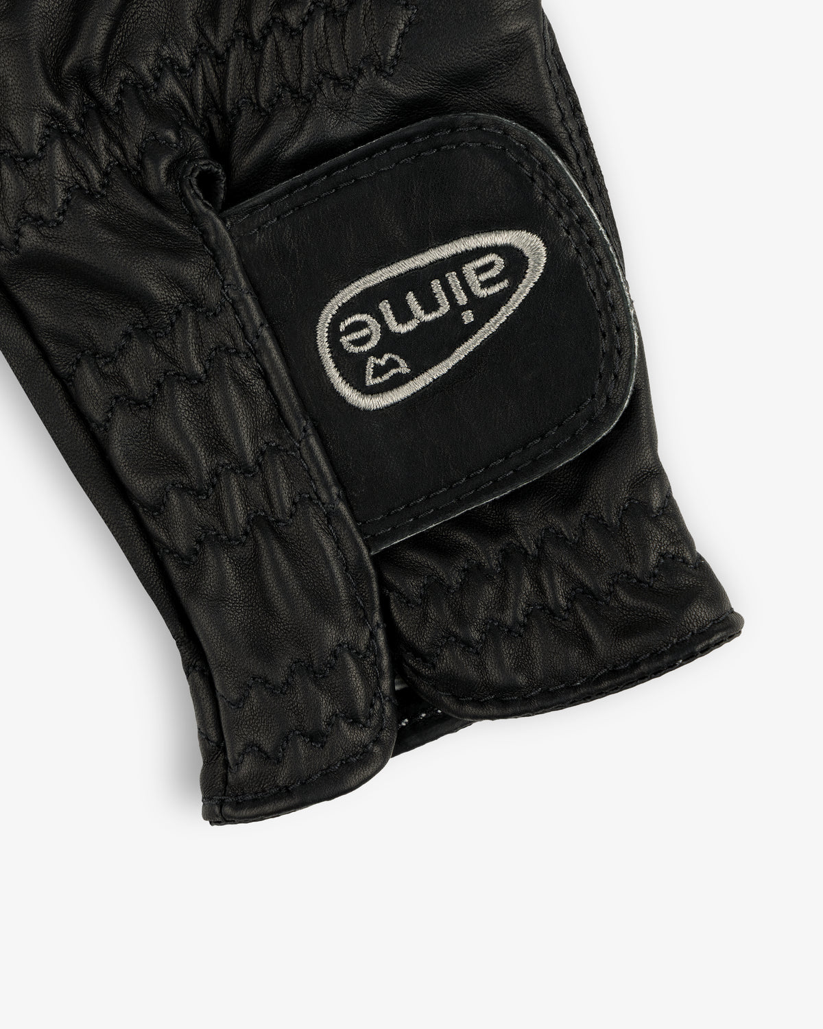 Black leather ALD / FootJoy StaSof Heritage Glove (Left) with visible stitching and a white aimé Velcro strap.