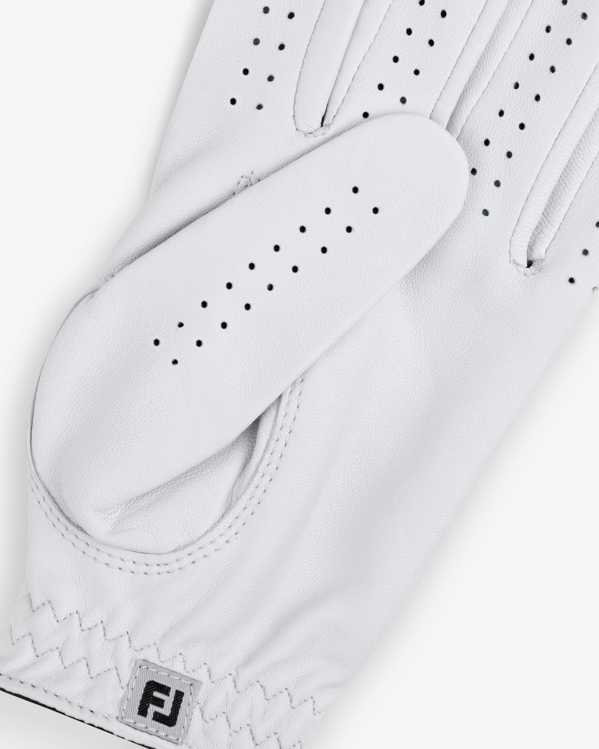 Close-up of the ALD / FootJoy StaSof Heritage Glove (Left) with perforations and FJ logo on the wrist.