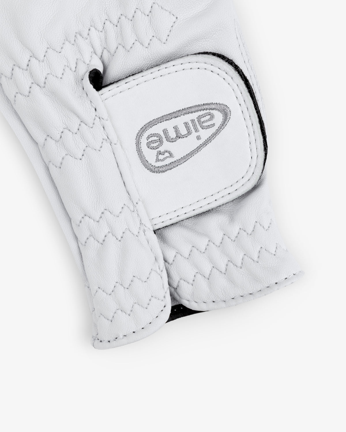 Close-up of the ALD / FootJoy StaSof Heritage Glove (Left) featuring zigzag stitching and a gray aimé Velcro strap.