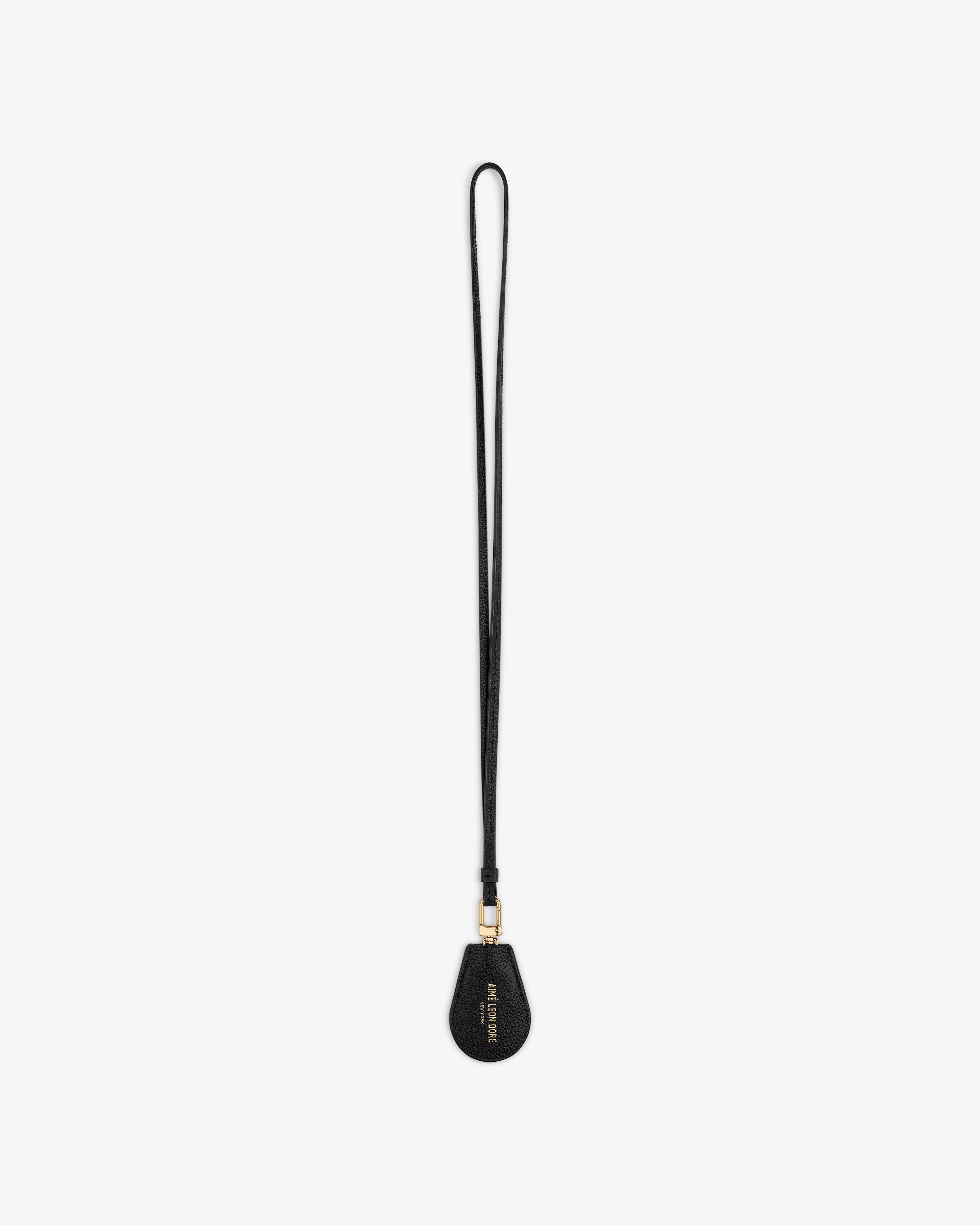 Black Leather Key Cover by Louis Vuitton with gold hardware and wrist strap, shown on a white background.