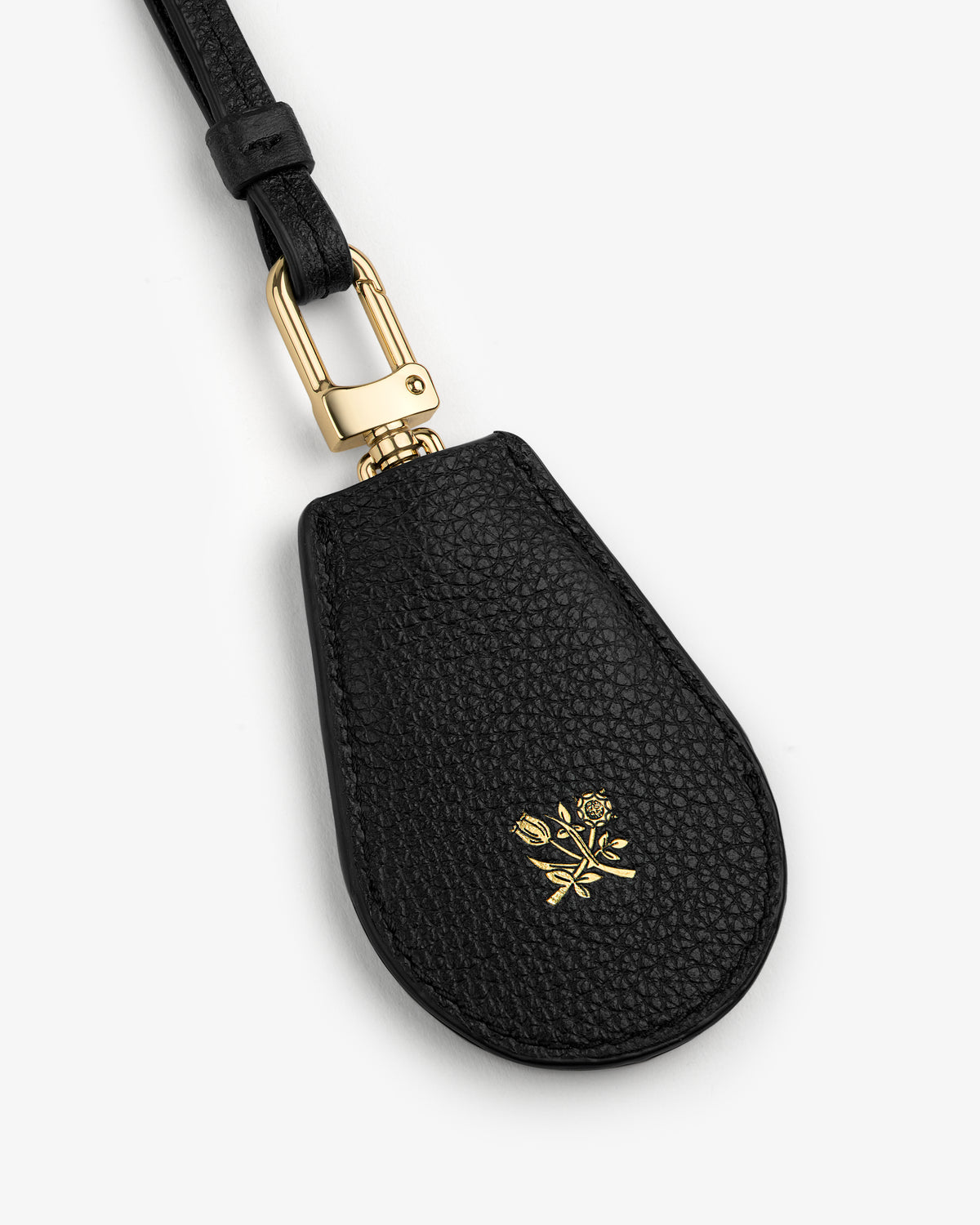 Black Leather Key Cover with gold clasp and embossed gold floral design near the bottom.