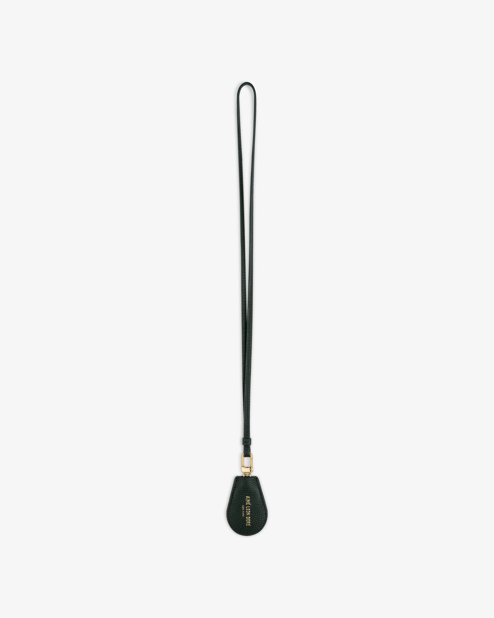 A black Leather Key Cover with a teardrop-shaped tag and gold hardware, shown on a white background.