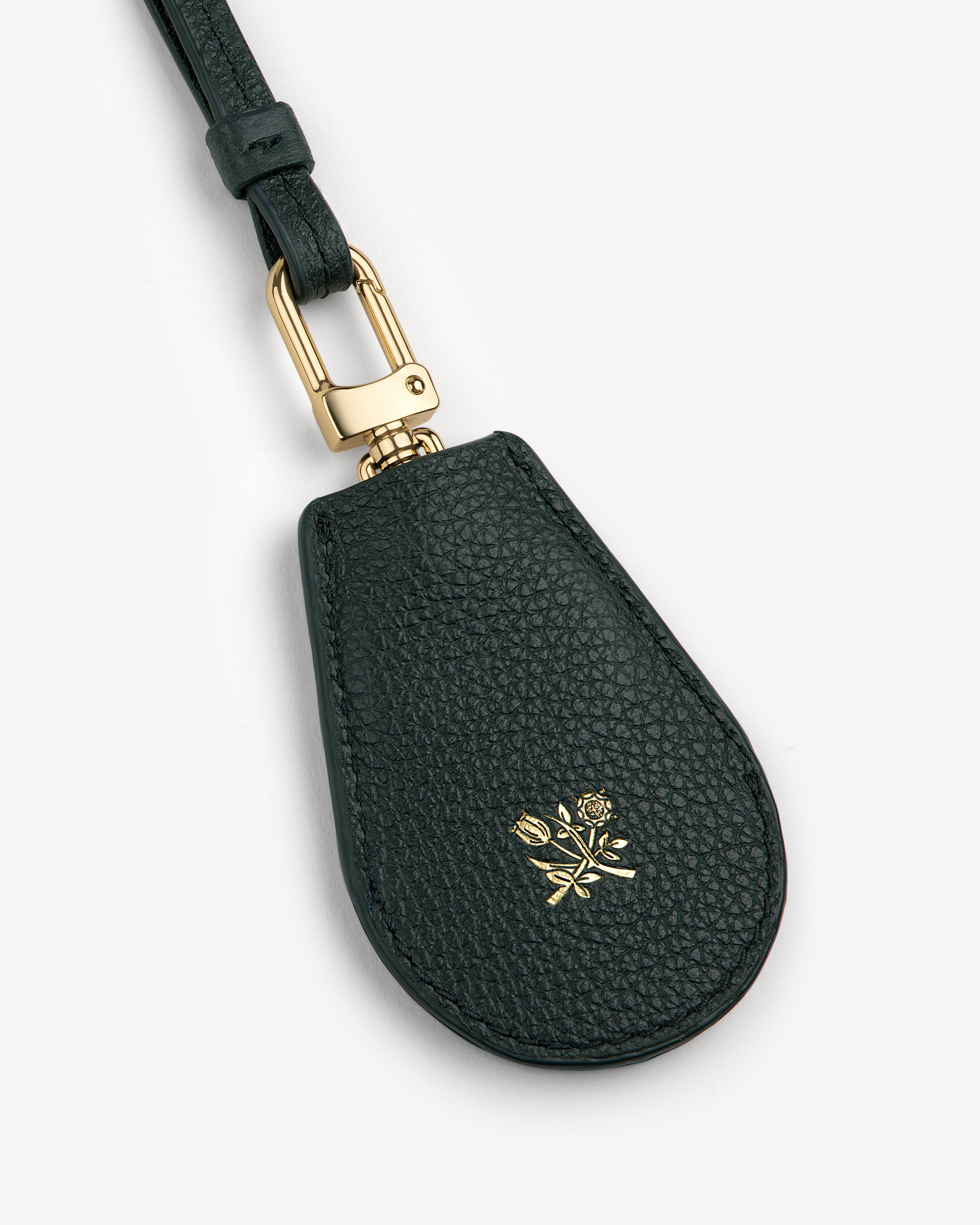 Leather Key Cover in black leather with gold hardware and an embossed small gold rose on the front.