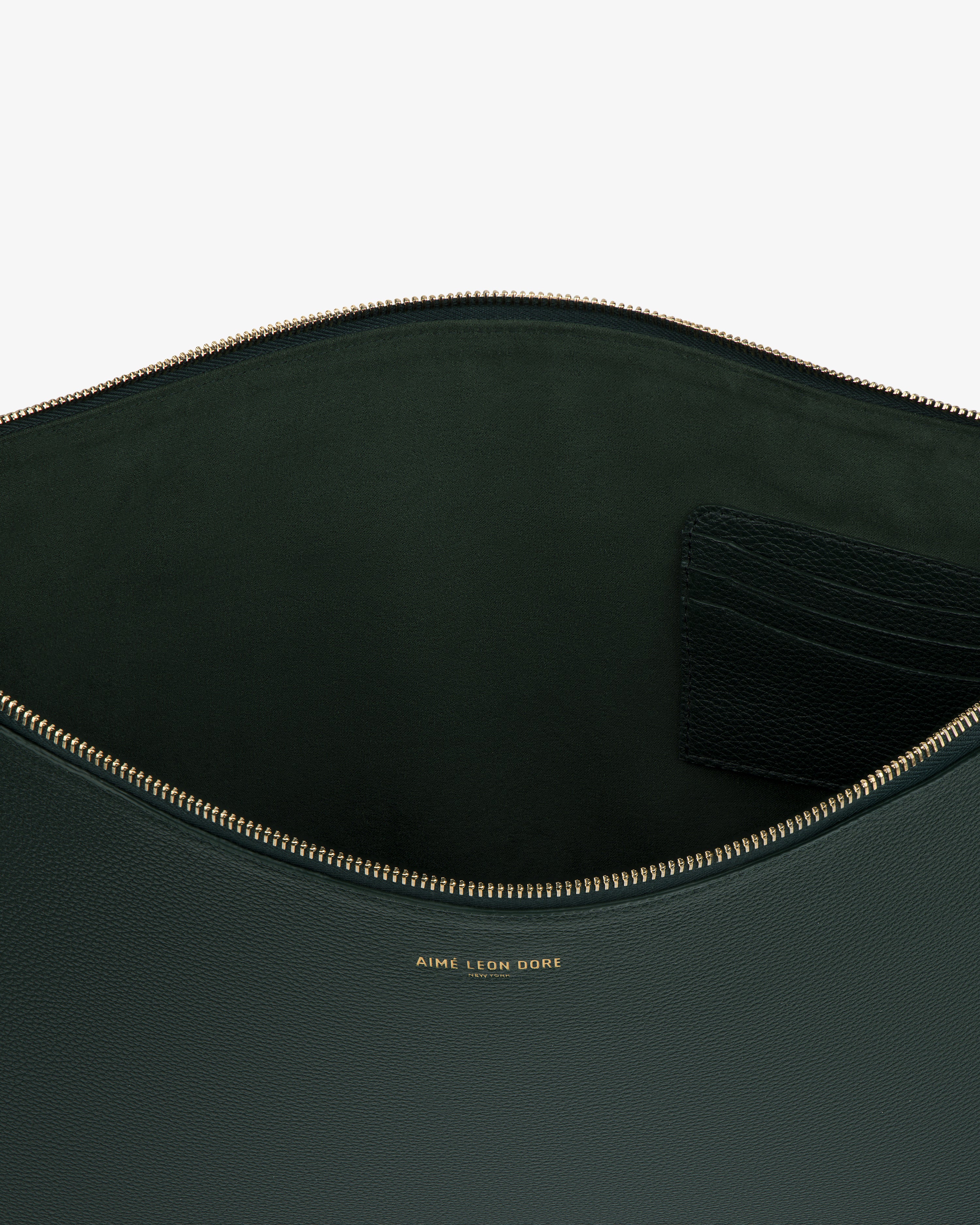 Large Leather Pouch in dark green leather with gold zipper, interior pocket, and gold Aime Leon Dore logo.