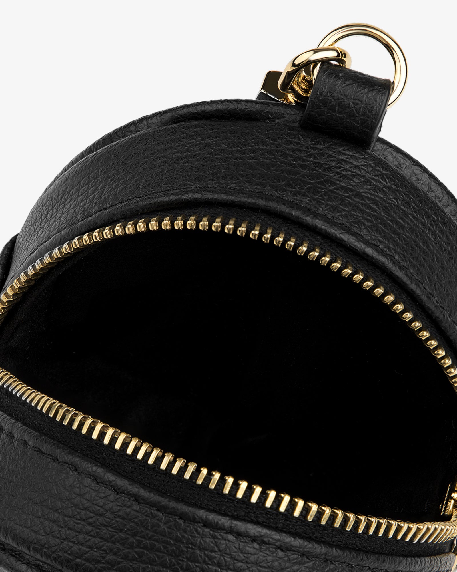 Close-up of an open Full Grain Leather Keychain Pouch with a gold zipper against a white background.