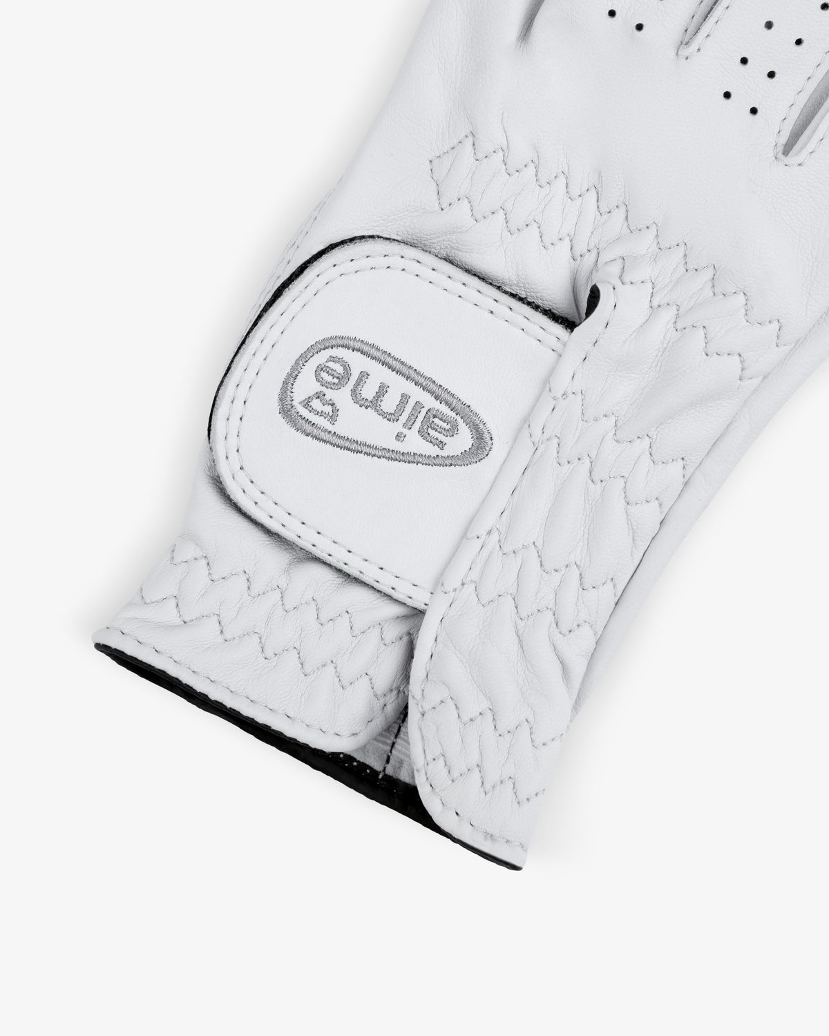 A close-up of the ALD / FootJoy StaSof Heritage Glove (Right) with a Velcro strap and eime logo on the wrist.