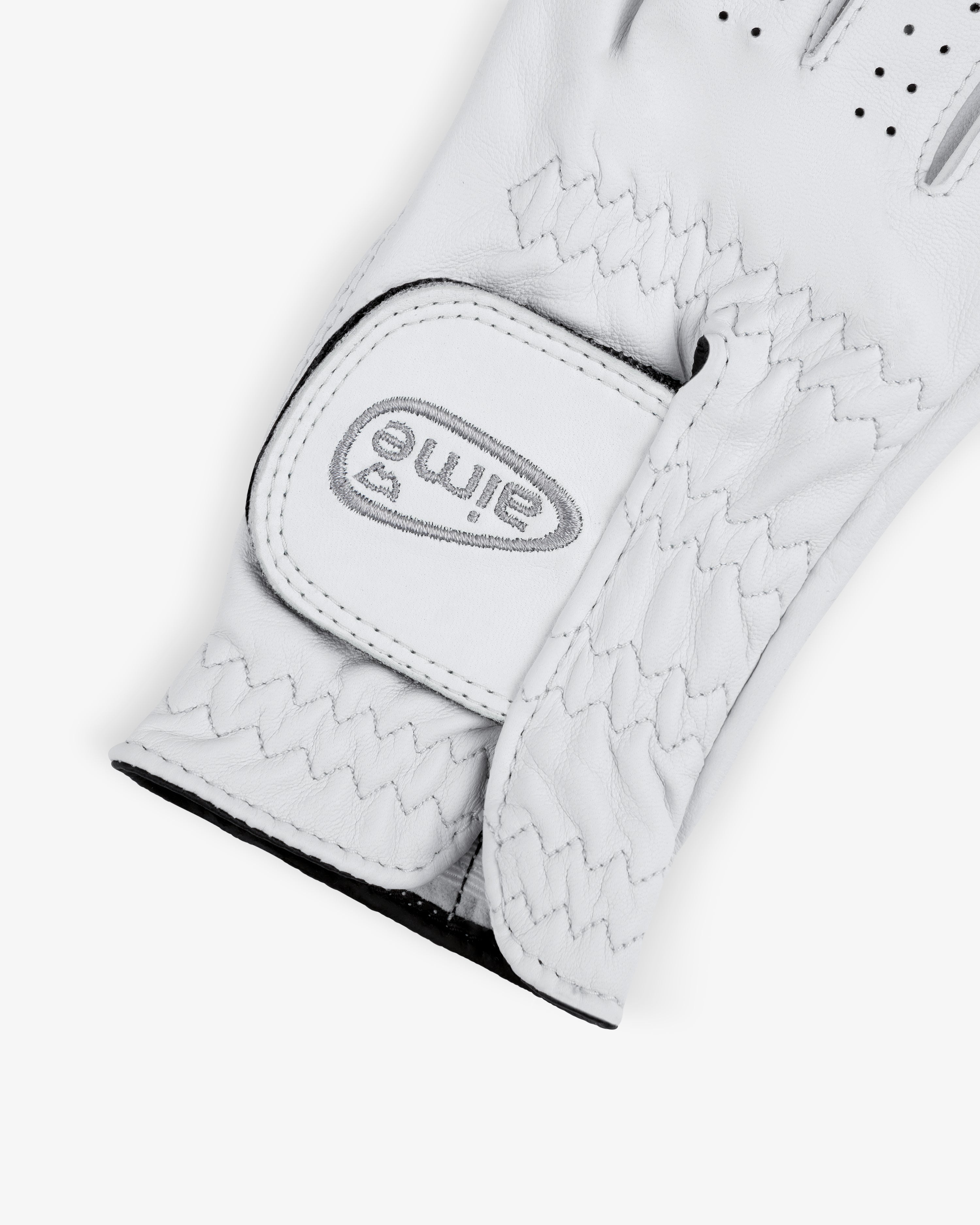 A close-up of the ALD / FootJoy StaSof Heritage Glove (Right) with a Velcro strap and eime logo on the wrist.