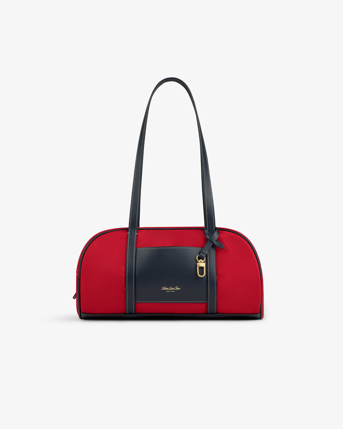Mini Duffle Shoulder Bag in red with long black handles, a black front pocket, and gold accent on white background.