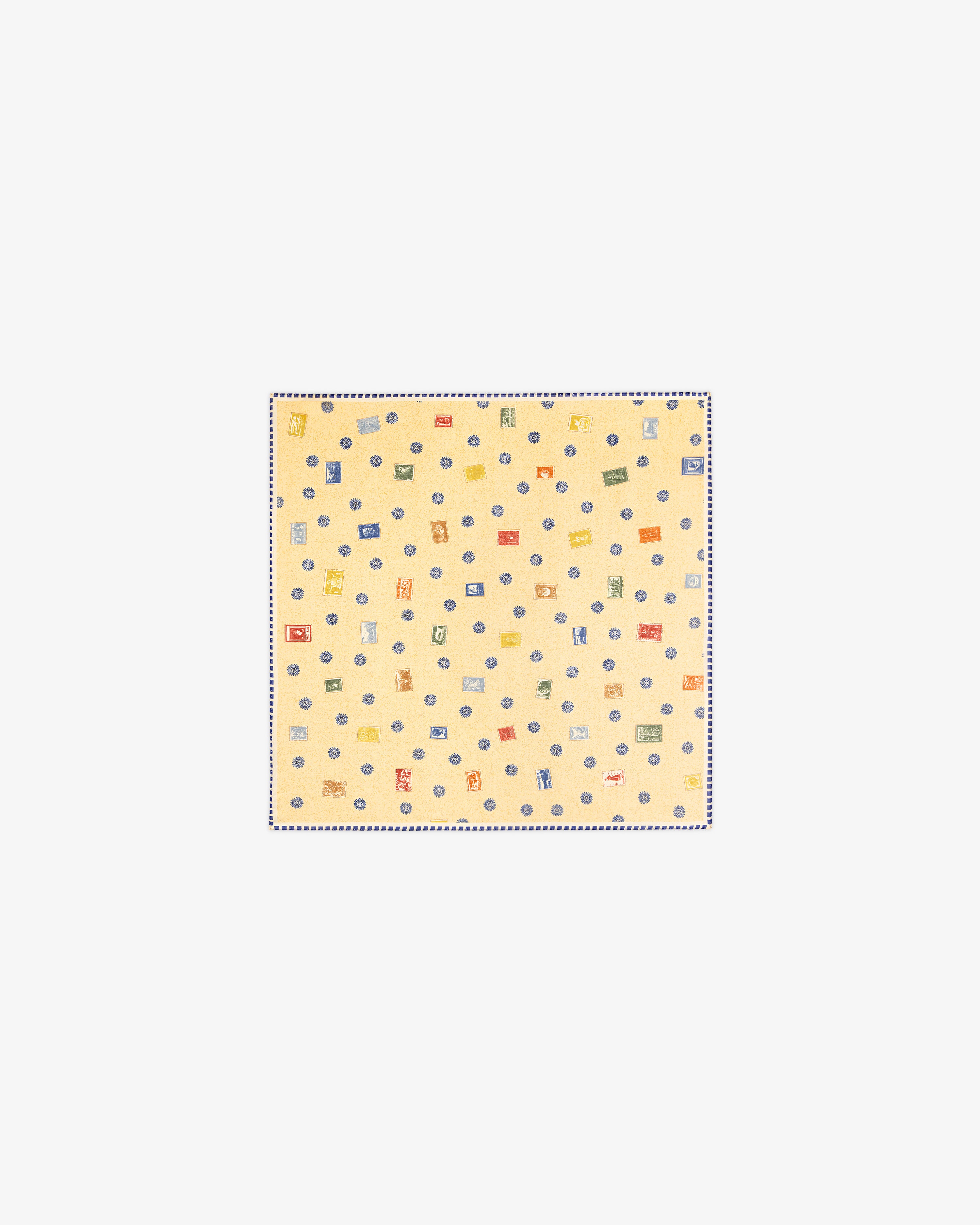 The Vintage Stamps Wool Silk Bandana is a light yellow square with small, colorful geometric patterns.