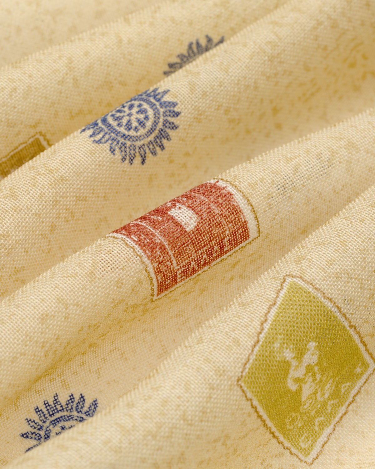 Cream-colored Vintage Stamps Wool Silk Bandana with blue, red, and green geometric and floral woven patterns.