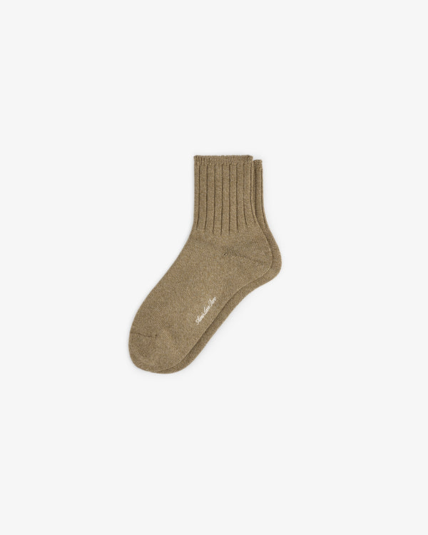 A single Marled Quarter Sock in brown with a small white sole logo, shown on a plain white background.