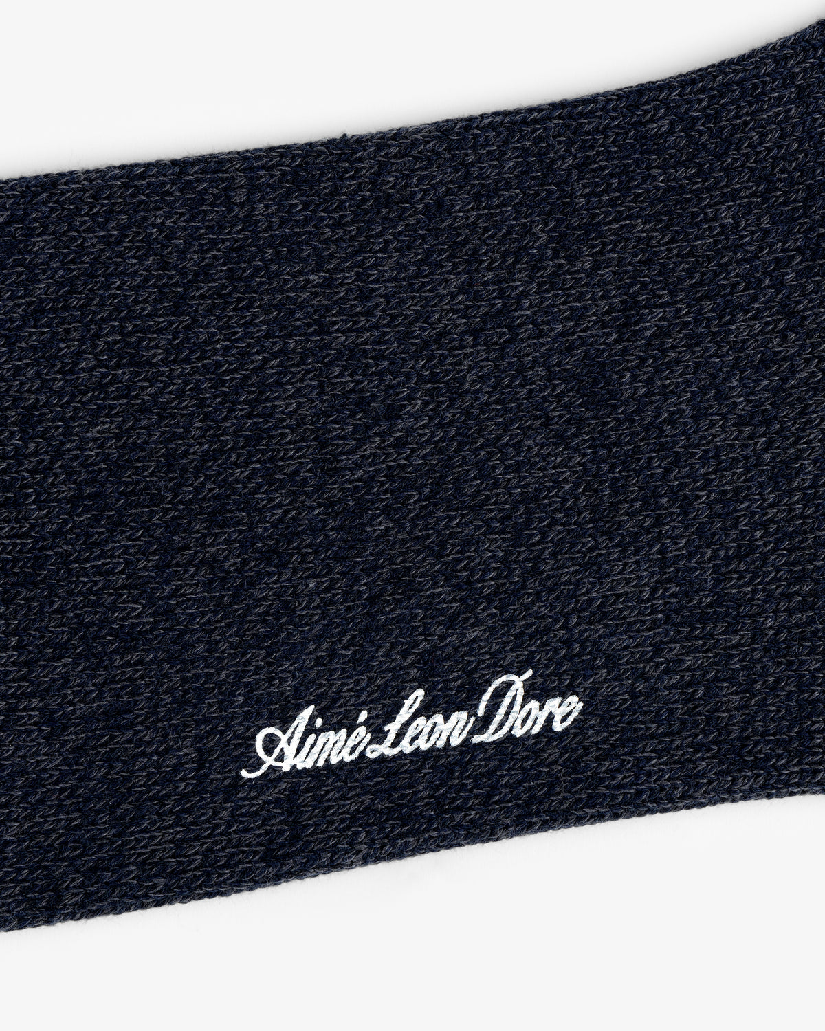 Close-up of Marled Quarter Sock knit with "Aime Leon Dore" embroidered in white cursive.