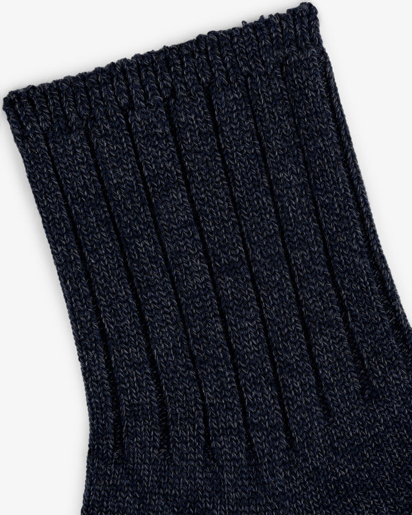 Close-up of the ribbed cuff on the Marled Quarter Sock in dark navy blue, highlighting its textured knit fabric.