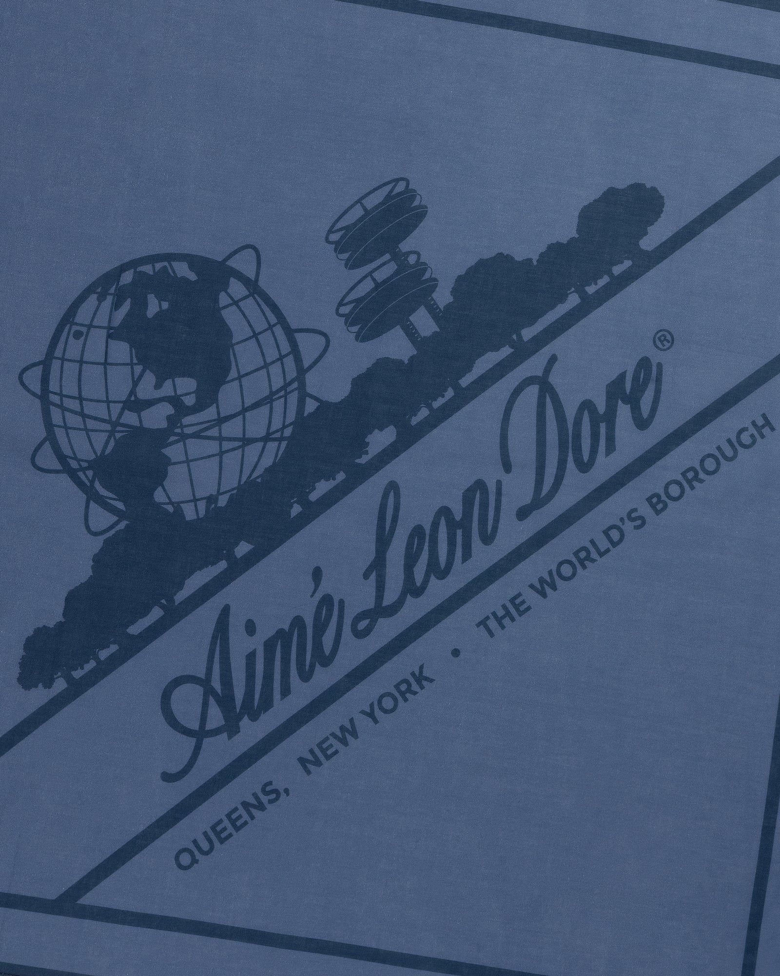 Sun Faded Unisphere Bandana with Ainé Leon Dore globe logo, trees, and "Queens, New York - The World's Borough" text.