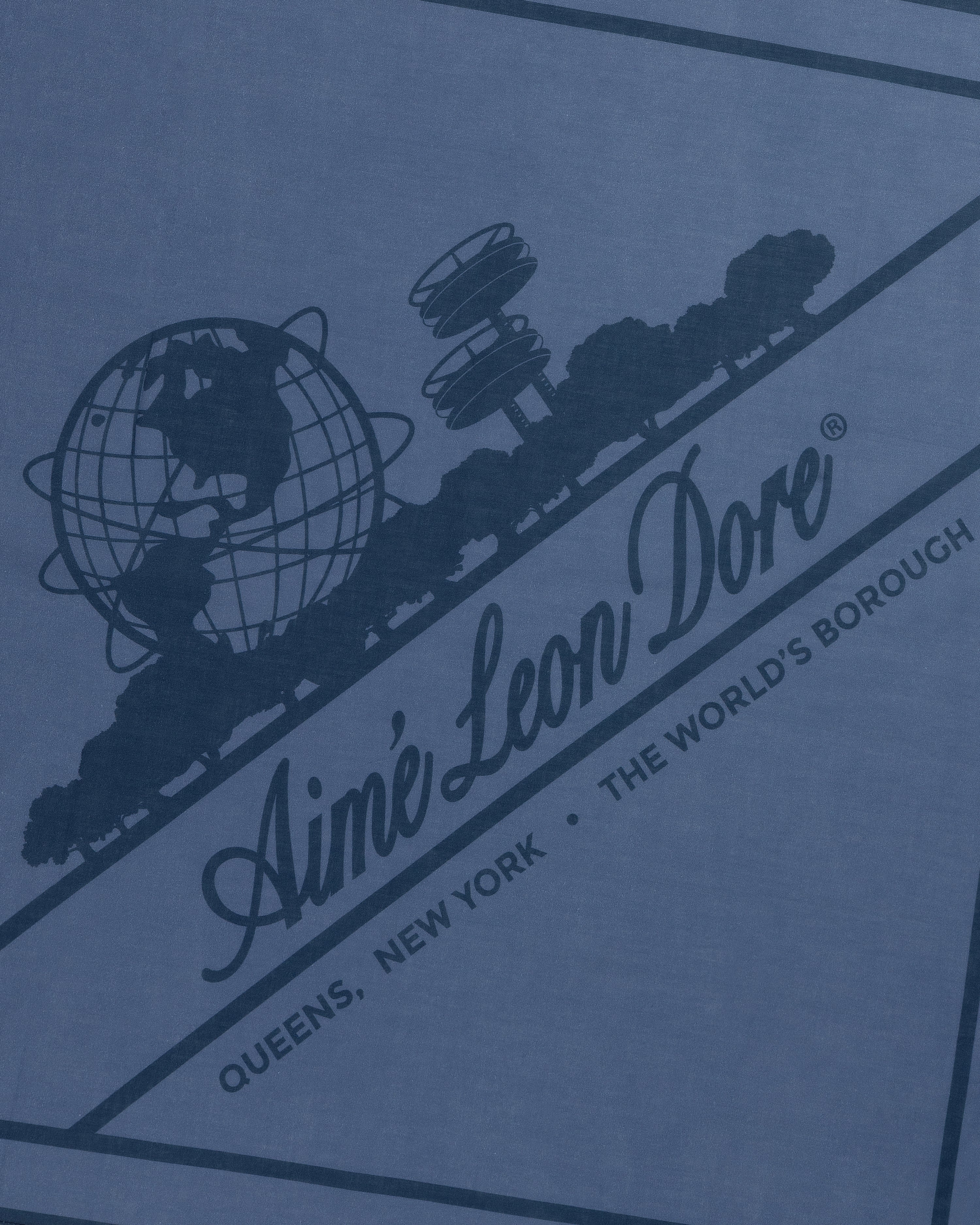 Sun Faded Unisphere Bandana with Ainé Leon Dore globe logo, trees, and "Queens, New York - The World's Borough" text.