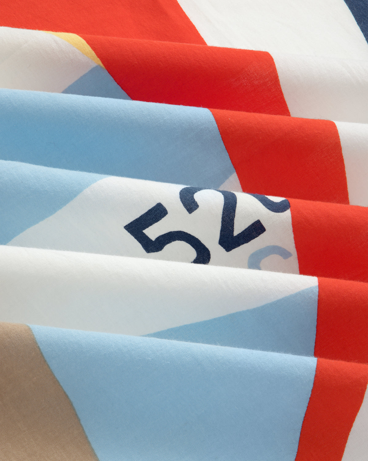 Close-up of the Regatta Bandana folded, showing colorful geometric patterns and the number 526 partly visible.
