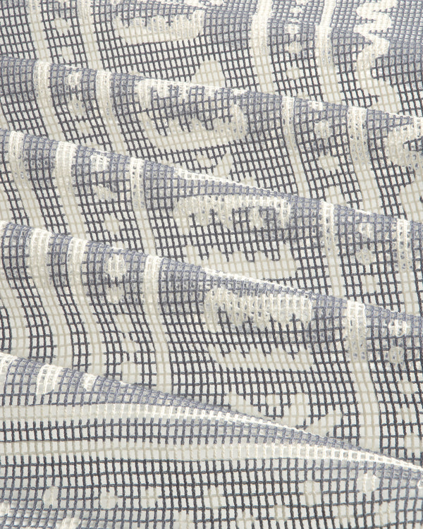 Close-up of the Mesh Tapestry Bandana featuring a geometric grid and wavy white and gray patterns.