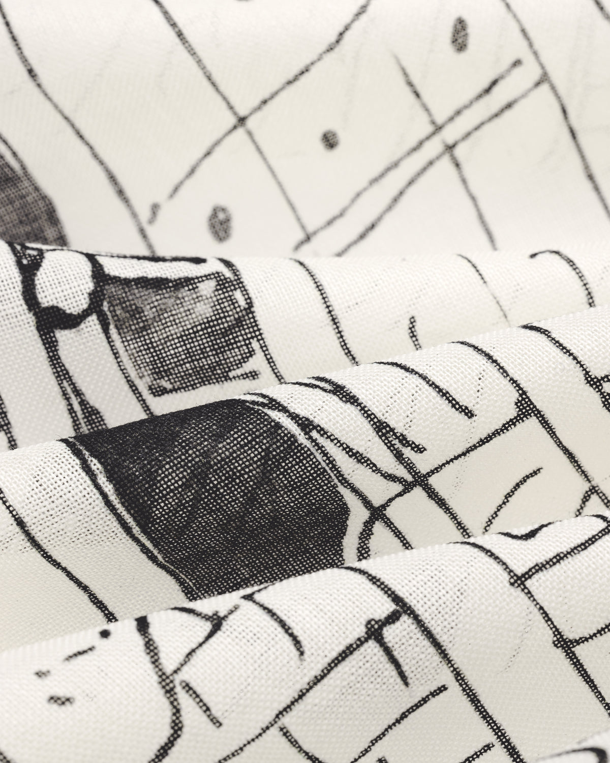 The Fassianos Neighborhood Bandana features white fabric with black abstract lines, dots, and artistic folds.