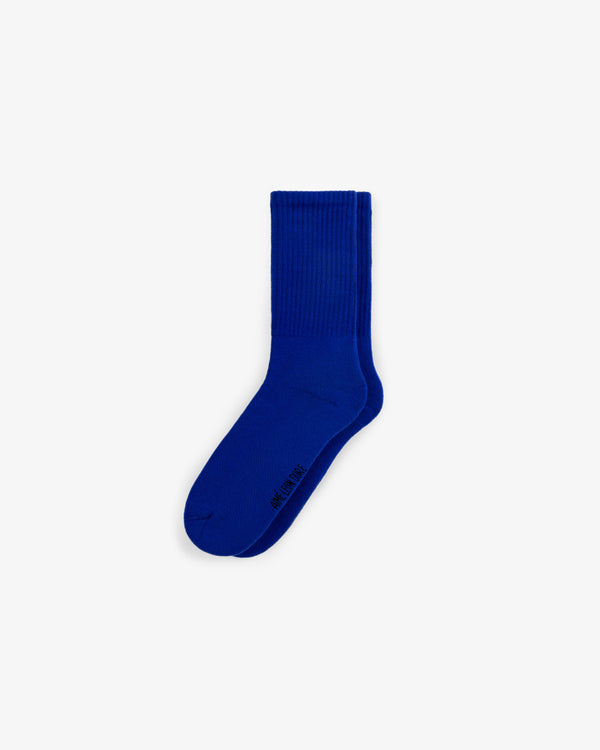 A 3-pack of bright blue crew socks with a small black logo by the toe, shown on a white background.