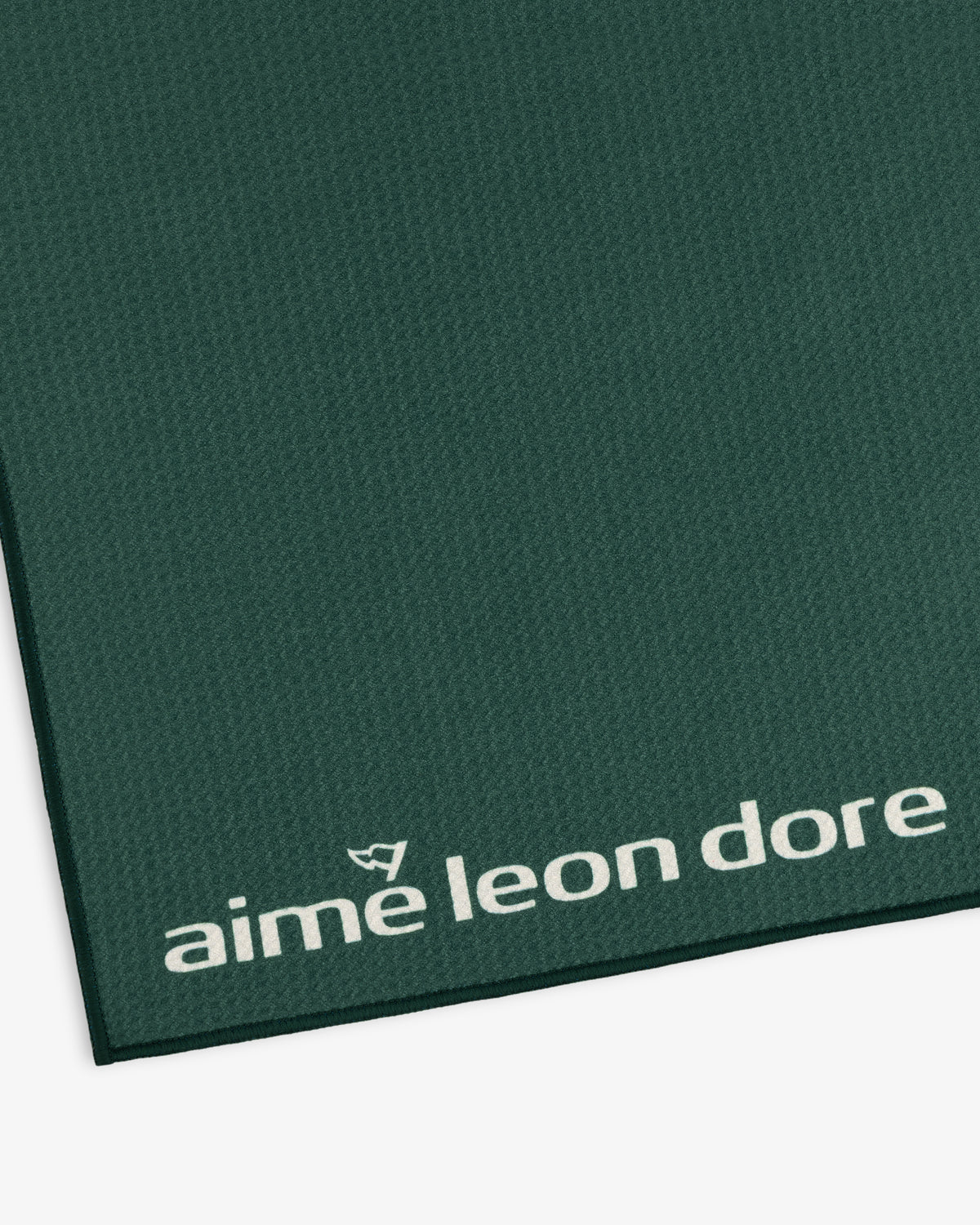 Dark green ALD Golf Caddy Towel with small white logo in the bottom right corner and textured finish.