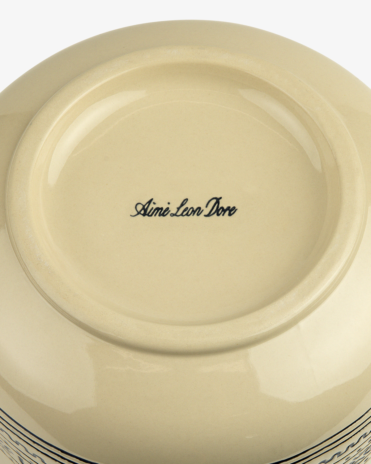 Cream-colored Textile Patterned Treat Jar with Aimé Leon Dore in black cursive at the center.