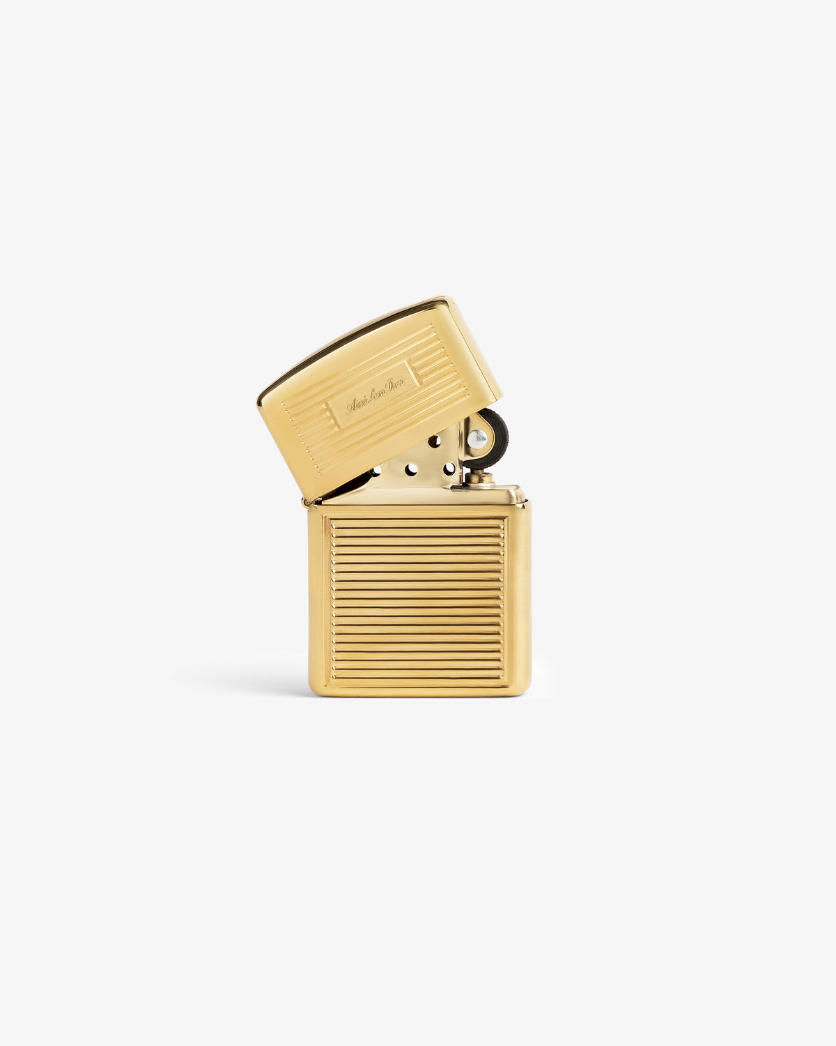 Brass Zippo Lighter with hinged lid, horizontal ridges, and engraved script on a plain white background.