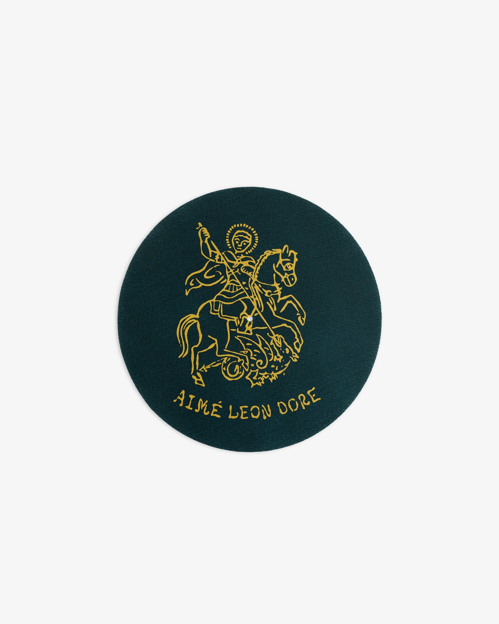 Round green Graphic Slip Mat featuring a gold knight on horseback and AIMÉ LEON DORE text below.