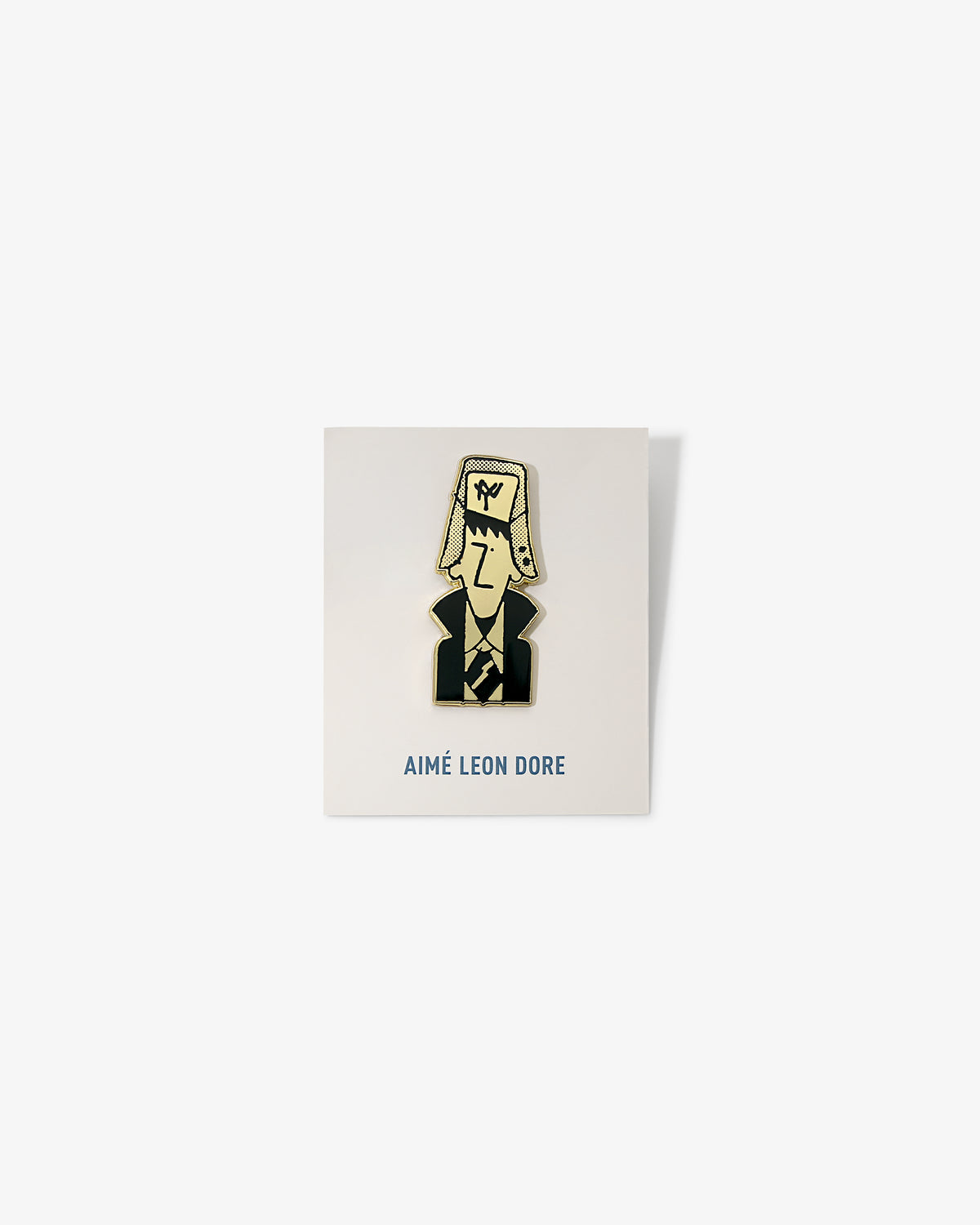 Graphic Pin featuring a cartoon person in a suit and hat, displayed on AIMÉ LEON DORE branded card.