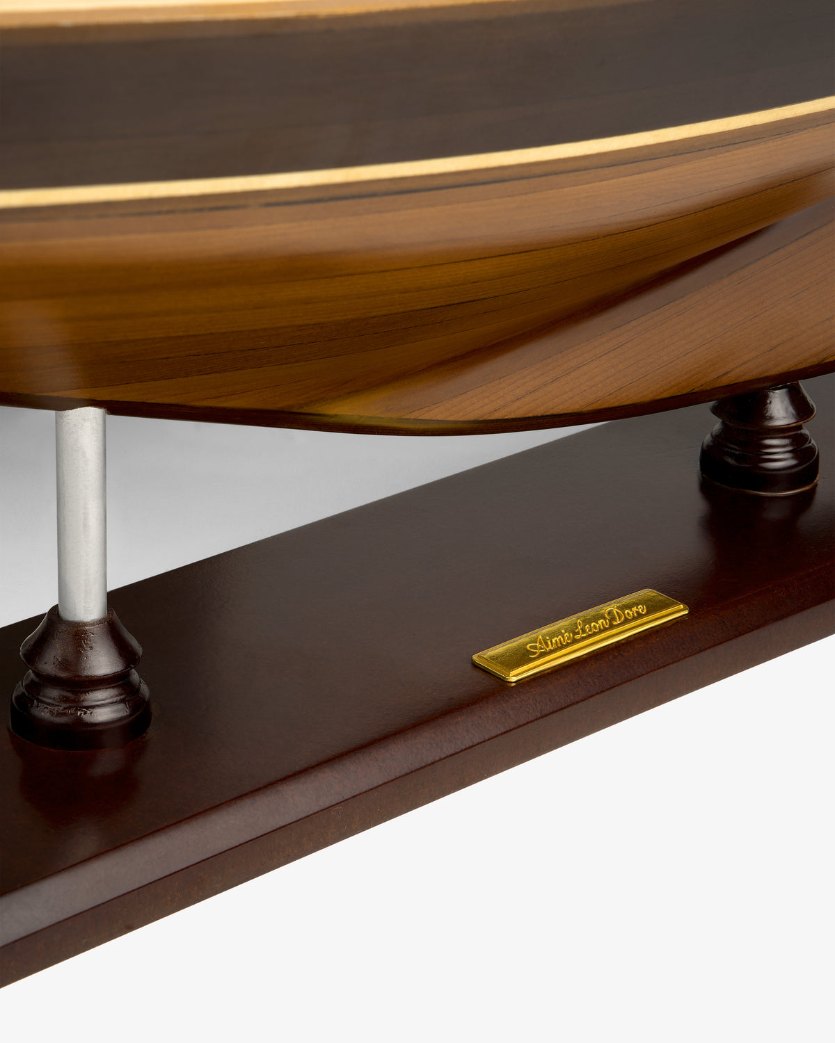 Close-up of Walnut Model Sailboat base with a gold nameplate reading Sailboat Lena Love.