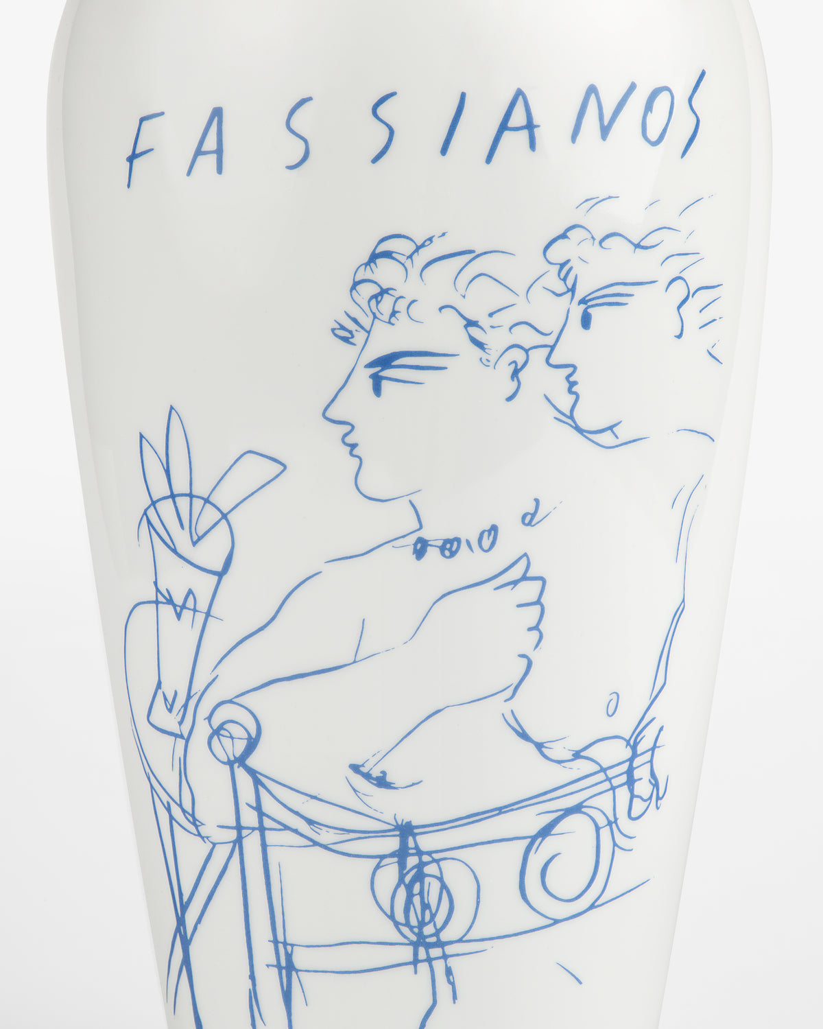 The Fassianos "Rendez-Vouz" Vase is white with blue line art of two figures and "FASSIANOS" at the top.