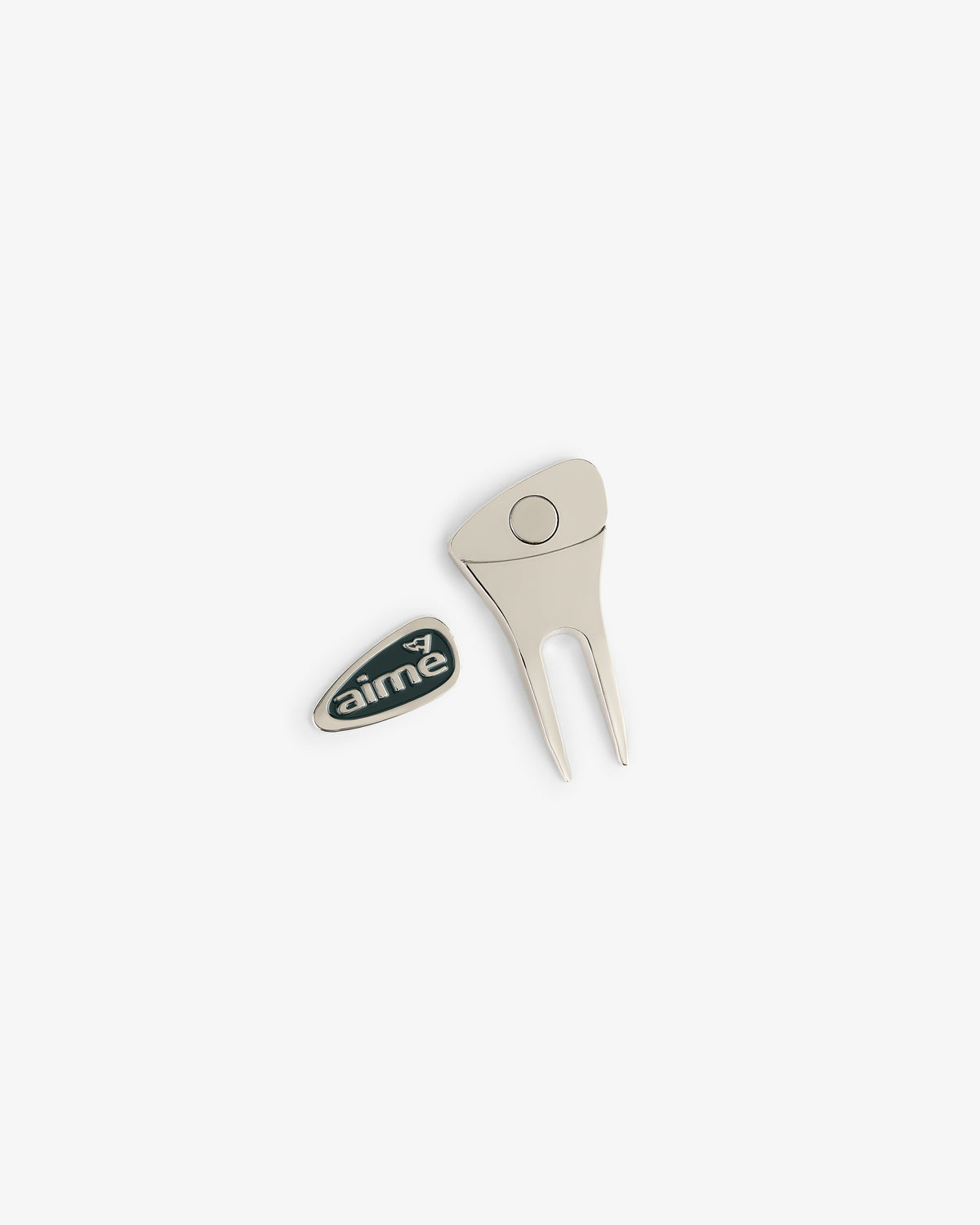 The ALD Golf Divot Tool and an oval AIME logo enamel pin on a white background.