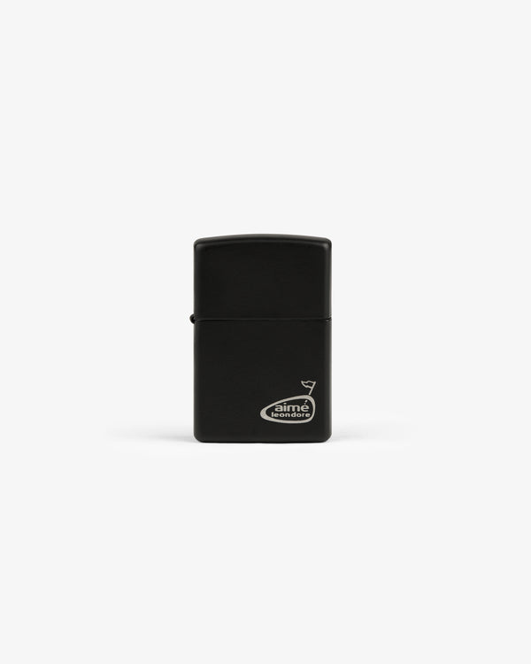 A black ALD Golf Cigar Torch Lighter with a small white Aimé Leon Dore logo on the lower right corner.