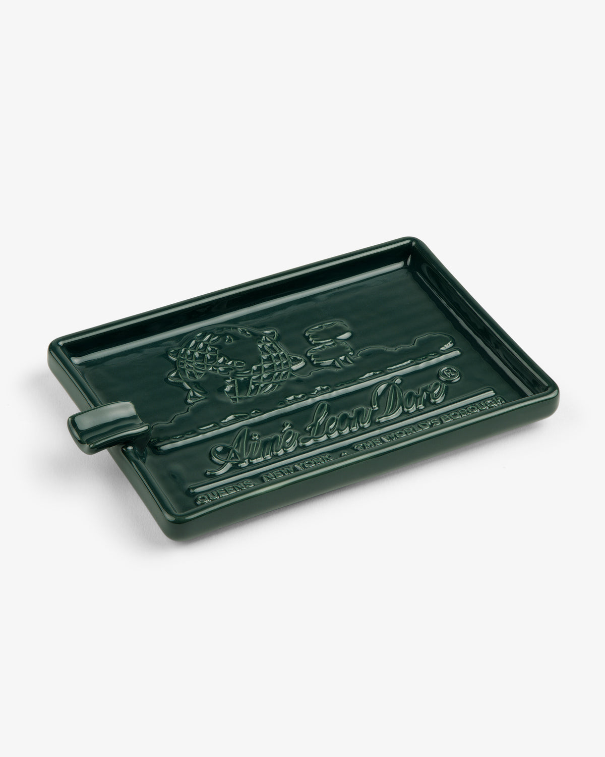Dark green rectangular Ceramic Unisphere Ashtray with embossed text and graphics, including “Ain’t Local Love.”.