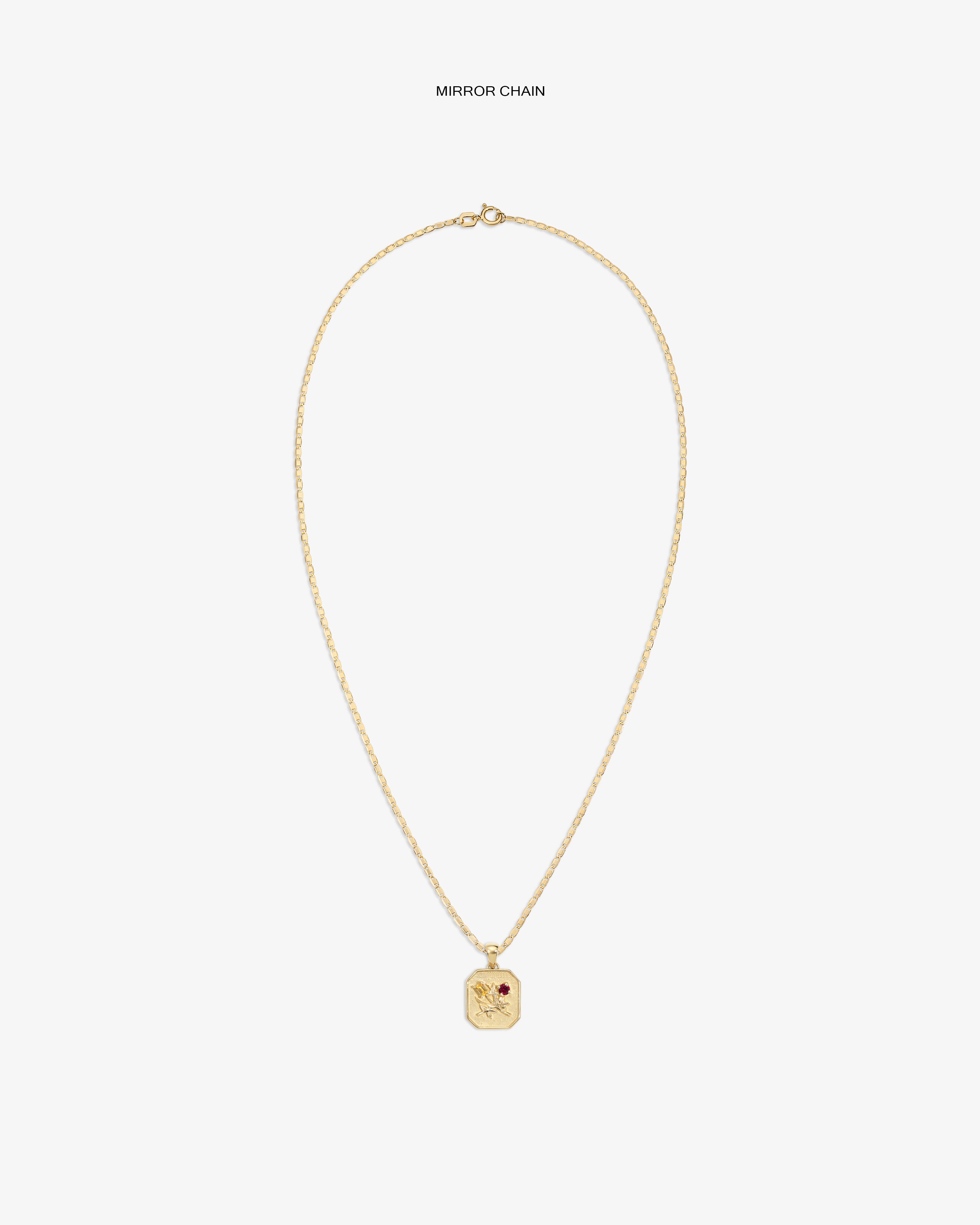 14Kt Gold Queens Crest Relief Pendant with small red gem, shown on a plain white background.