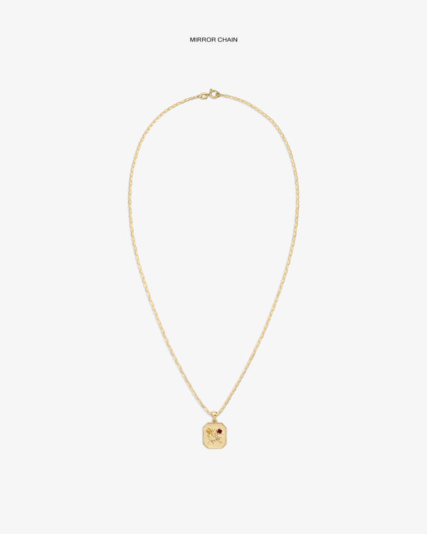 14Kt Gold Queens Crest Relief Pendant with small red gem, shown on a plain white background.